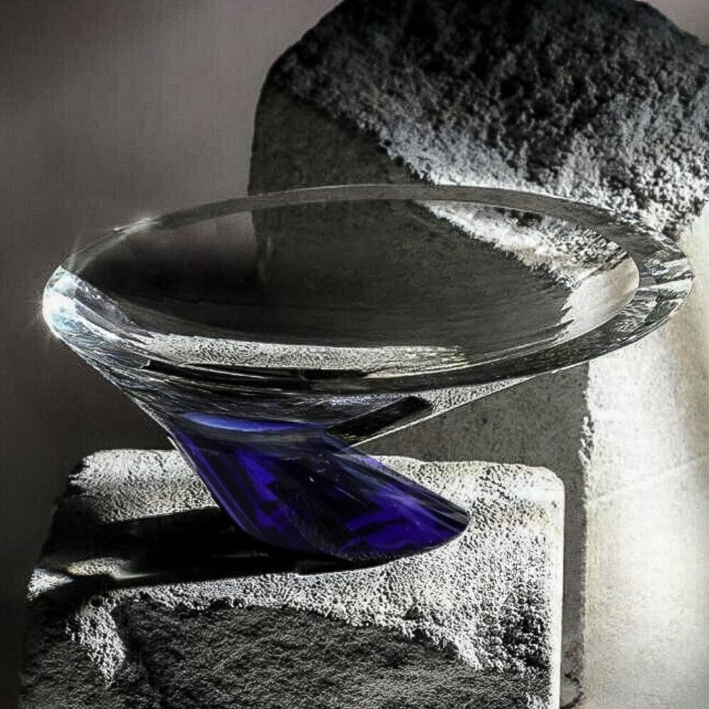 Introducing the All'EDEN Handmade Crystal Decorative Bowl in a stunning blue and clear design. This exquisite piece is expertly crafted by skilled artisans, showcasing a beautiful interplay of rich blue tones and crystal clarity. The unique color