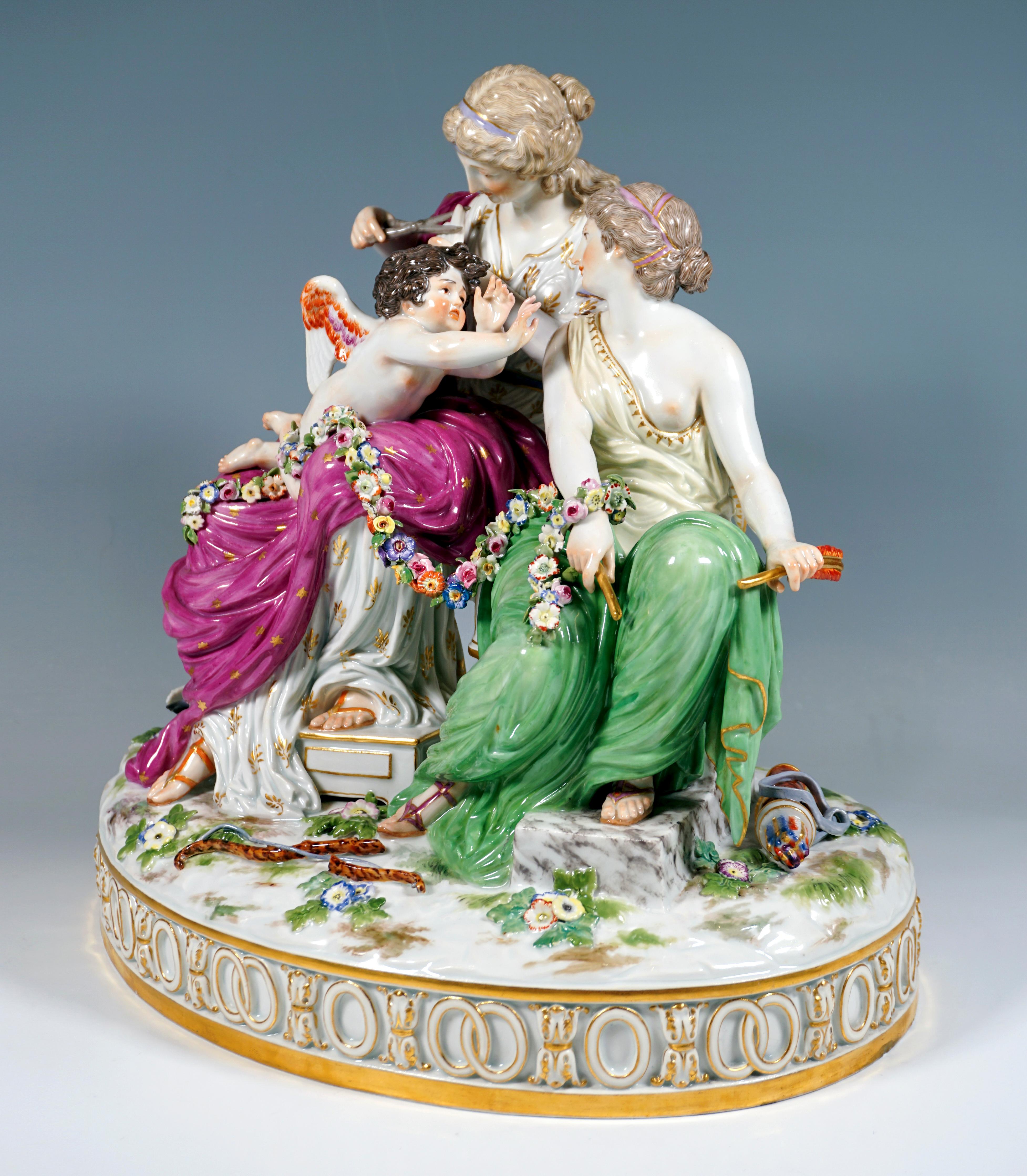 Very delicate Meissen porcelain group of the 19th century:
The Roman goddess of love, Venus, is sitting on a bench and clipping the wings of Cupid, who is lying on his stomach on her lap. The latter desperately resists the measure and turns to