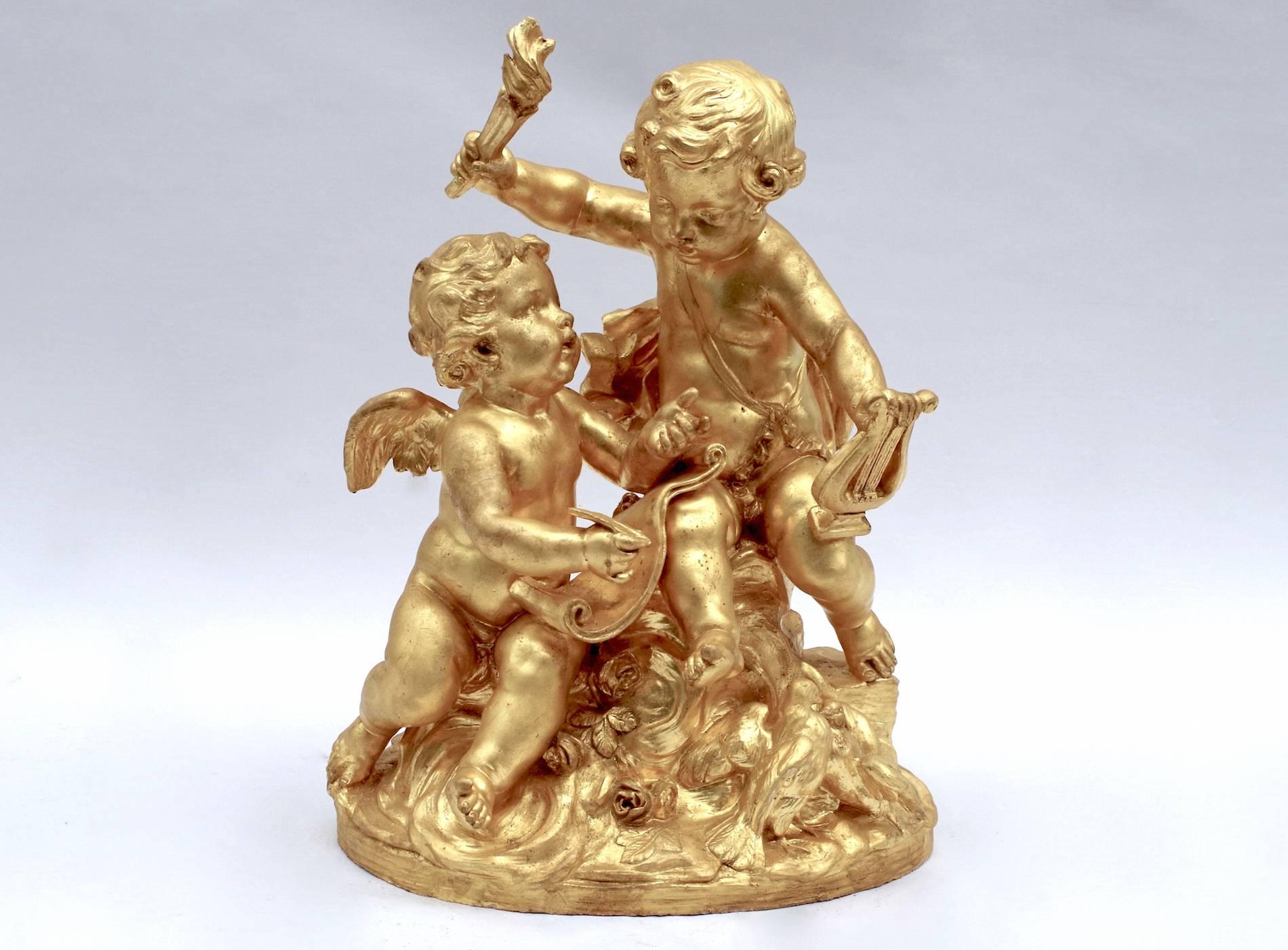 Atelier Prométhée, author. 

Gilt and patinated terracotta sculpture representing games of putti.
Allegory of Music, or rather of lyrical love, figuring two putti, one writing music, the second holding in the right hand a torch, symbolizing love,