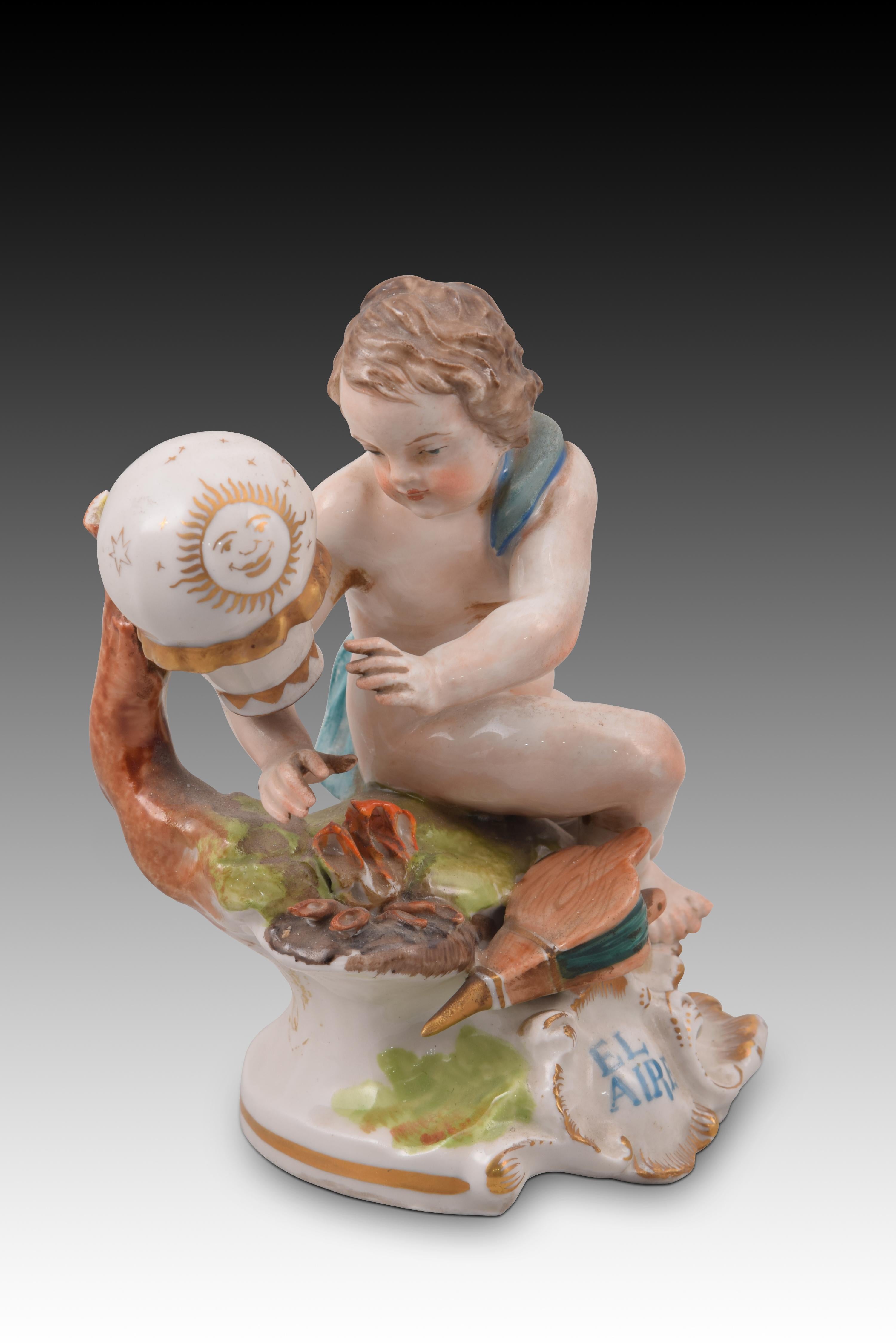 Allegory of the Air. Glazed porcelain. Hispania porcelain, Spain, 20th century. 
With marks.
Enameled porcelain figurine with touches of gold that shows a half-naked boy, with an old-style hot air balloon and a bellows, seated on a base of clear