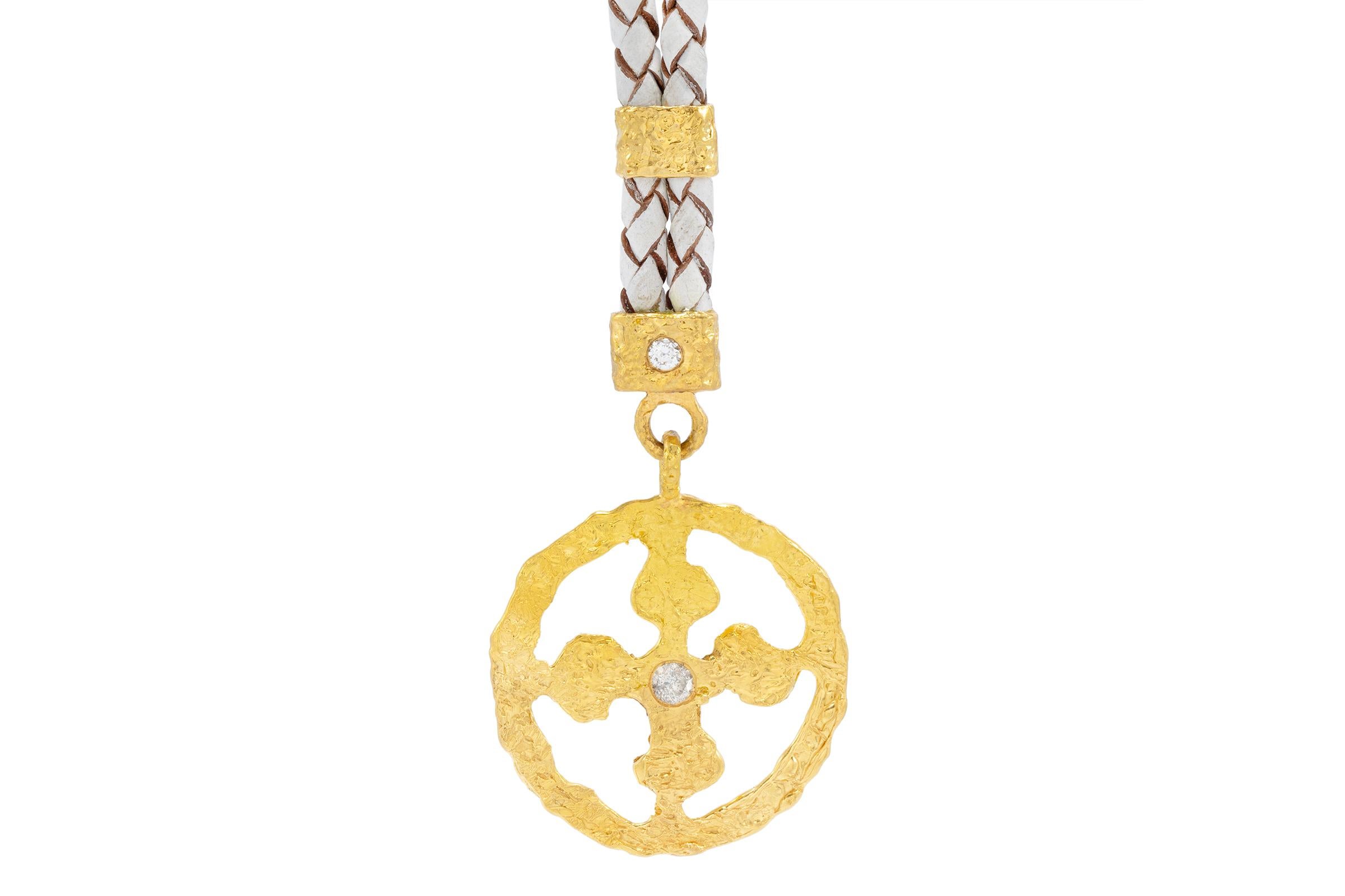 The Allegra Crusader Cross Pendant is handcarved in 22k gold. The Crusader Cross features Tagili Designs signature finish, is intricately hand carved and finished with a center diamond approximately 2.9mm. These specially designed pendants were made