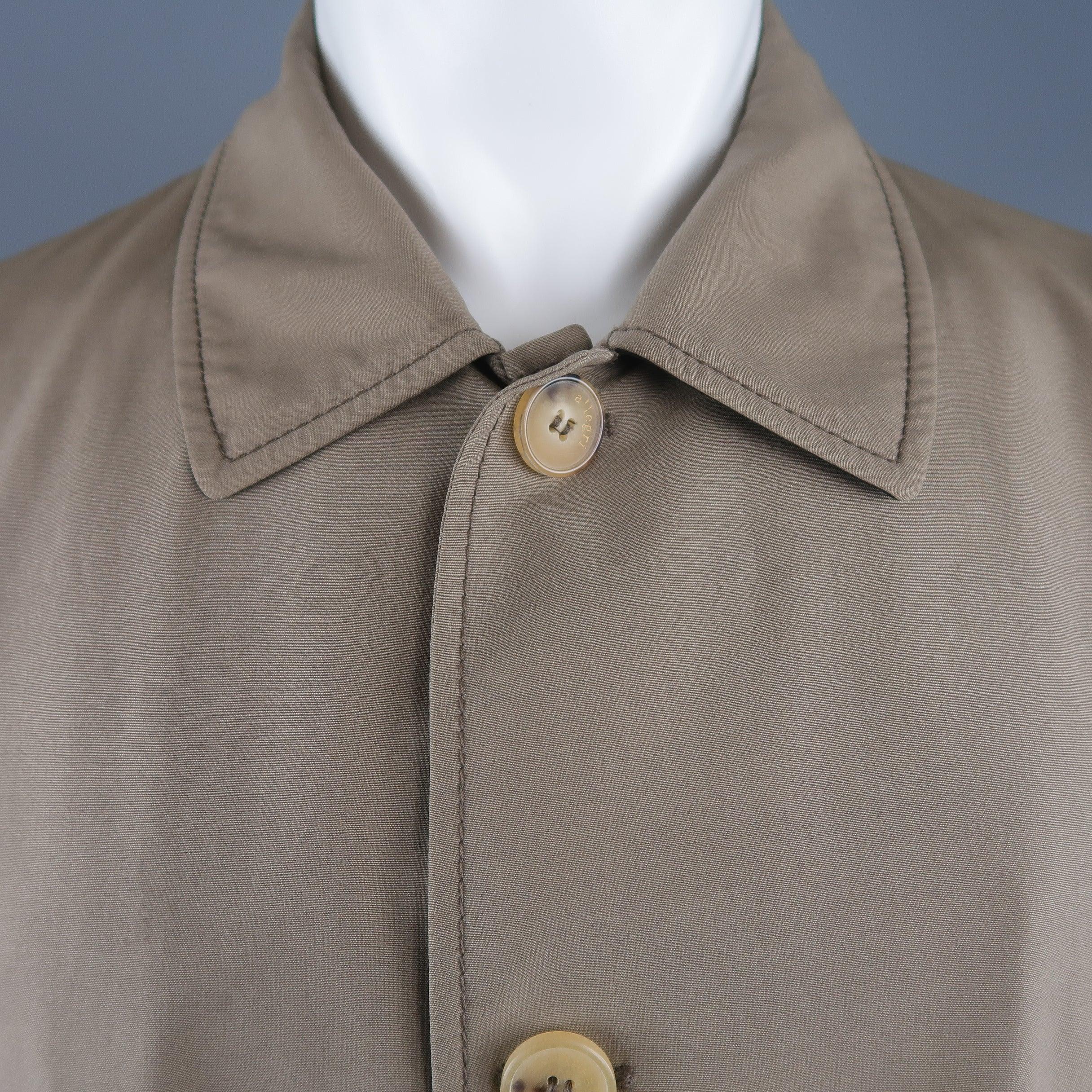 ALLEGRI car coat comes in dark khaki wool blend fabric with a pointed collar, button up front, tab cuffs, and zip pockets. Stain on chest. As-is. 
Made in Italy.Good Pre-Owned Condition. 

Marked:  IT 50 

Measurements: 
 
Shoulder: 19 inches Chest: