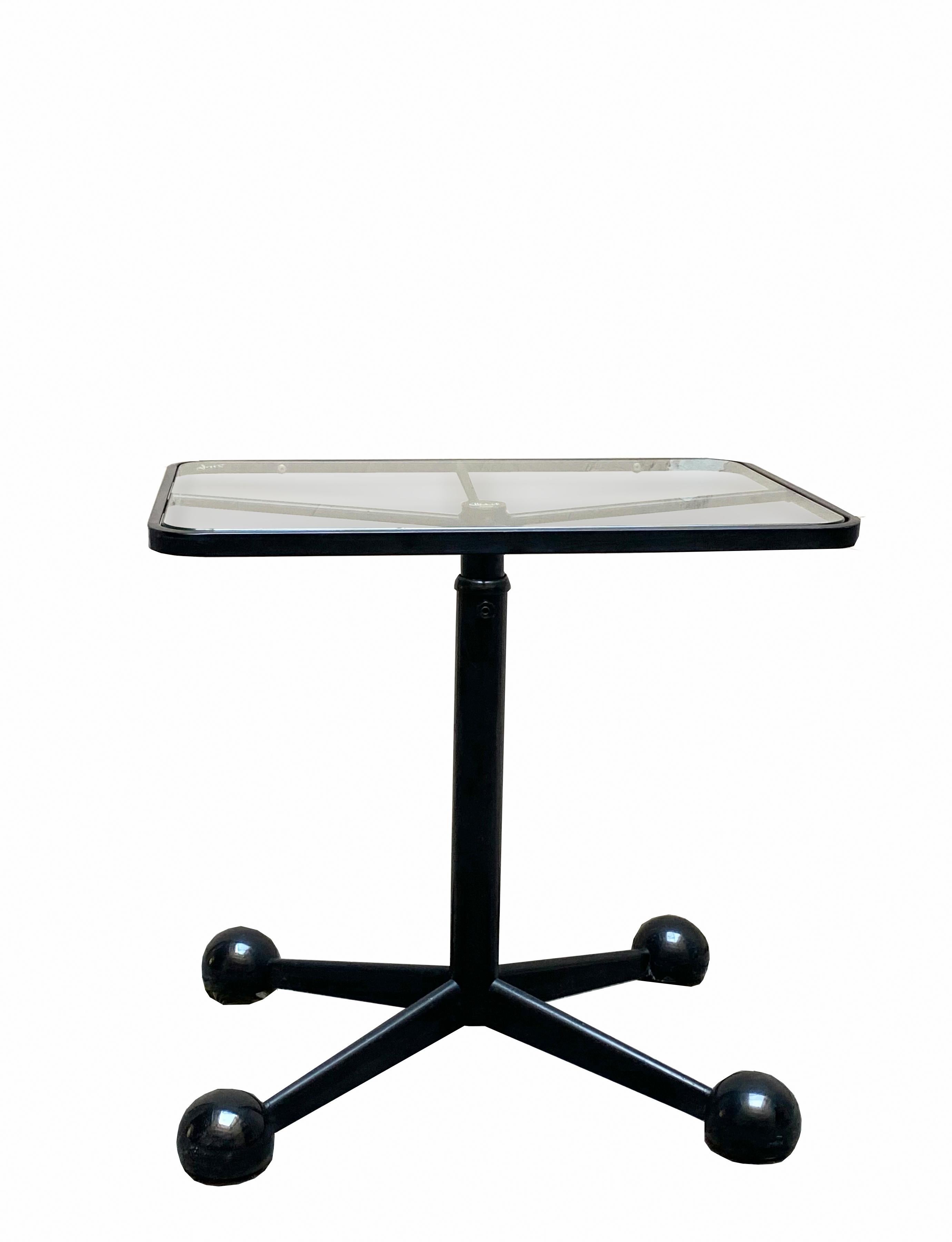 Height-adjustable swivel table/trolley in lacquered steel with glass top. Original Allegri design. 
 