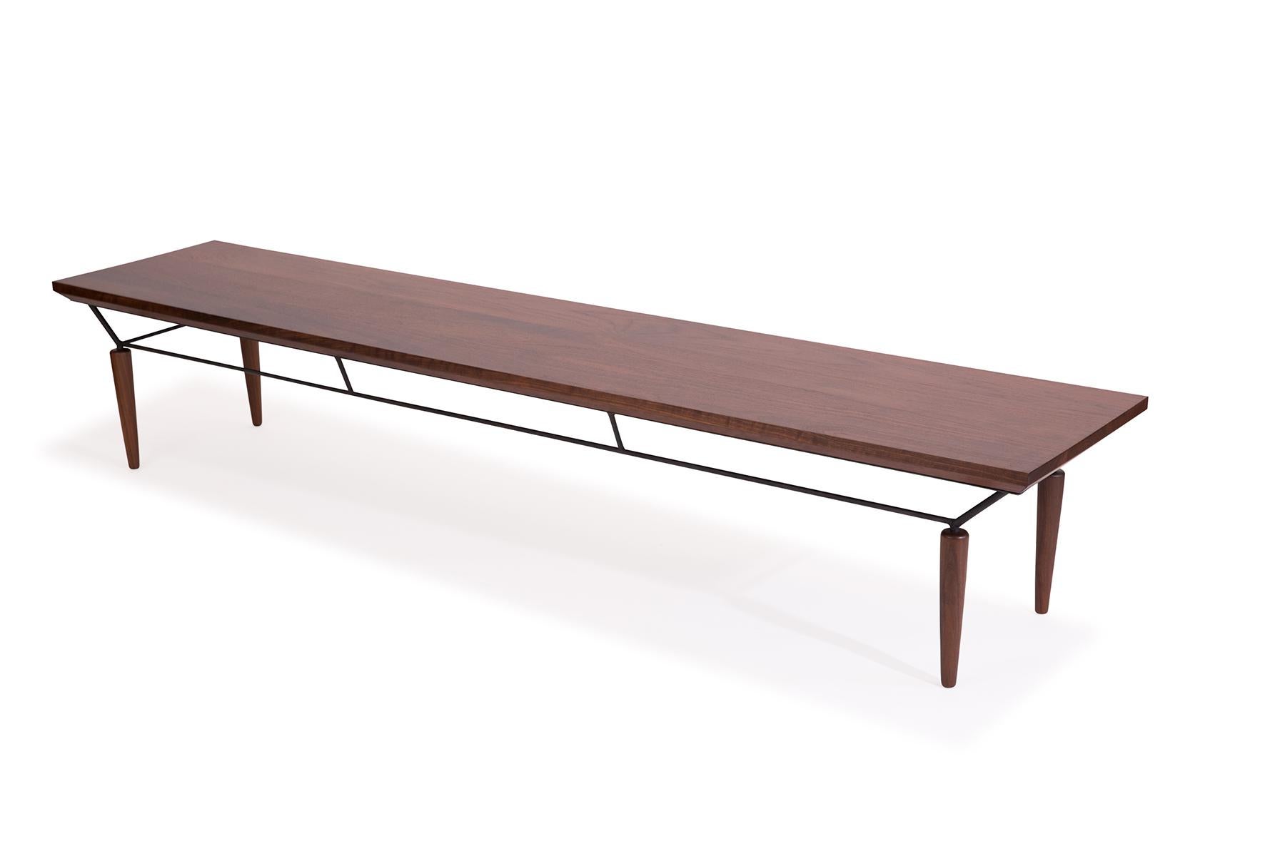 Allen Ditson solid walnut and iron bench or coffee table circa early 1960s. Top and legs are beautifully grained tapered walnut and stretchers and acents are patinated iron.