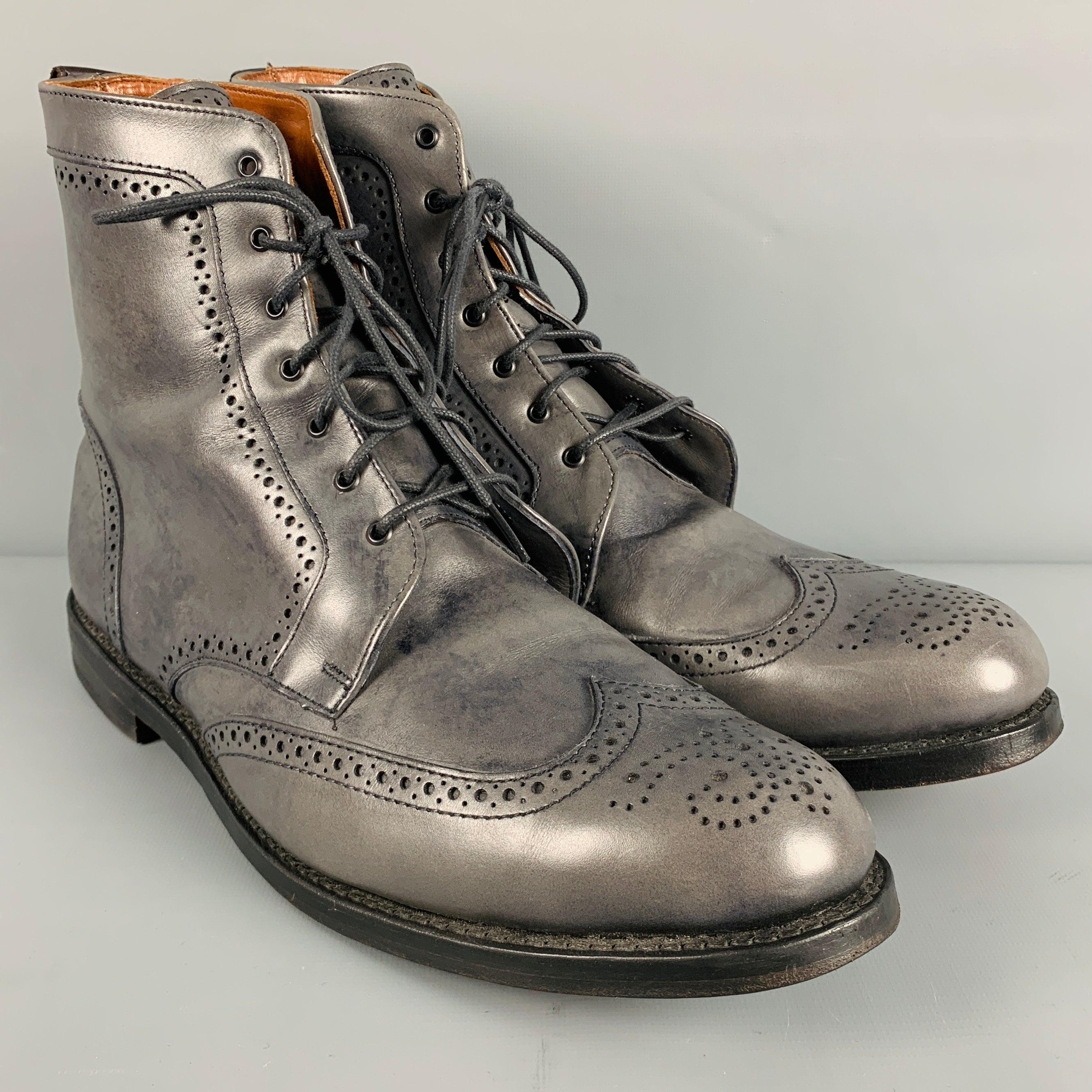 ALLEN EDMONDS boots
in a grey perforated leather featuring a wingtip style, and lace-up closure. Comes with dust bag.Excellent Pre-Owned Condition. 

Marked:   13 D 0110 28967 

Measurements: 
  Length: 12.75 inches Width: 4.25 inches Height: 8