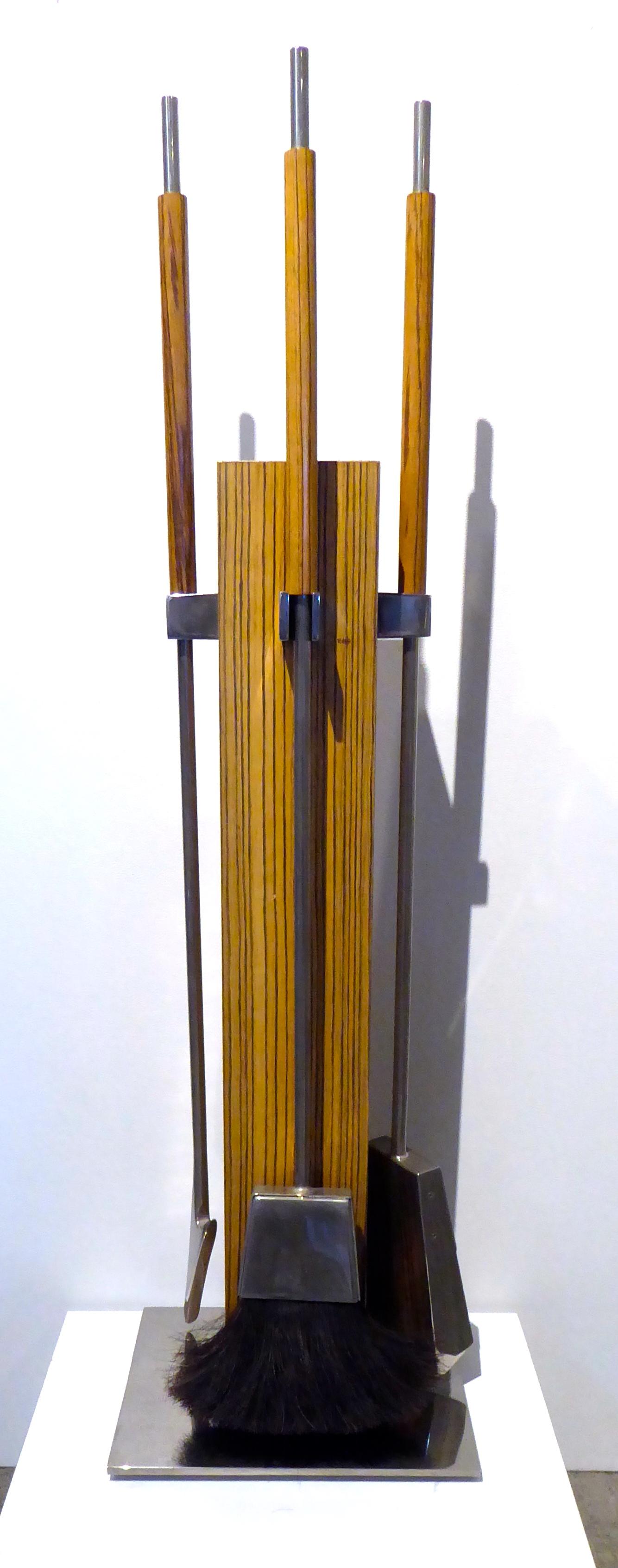 A four-piece zebra wood and chrome-plated steel fire tool set designed by Allessandro Albrizzi in the 1970s. These sets are generally seen in Lucite but the zebra wood was an available option.