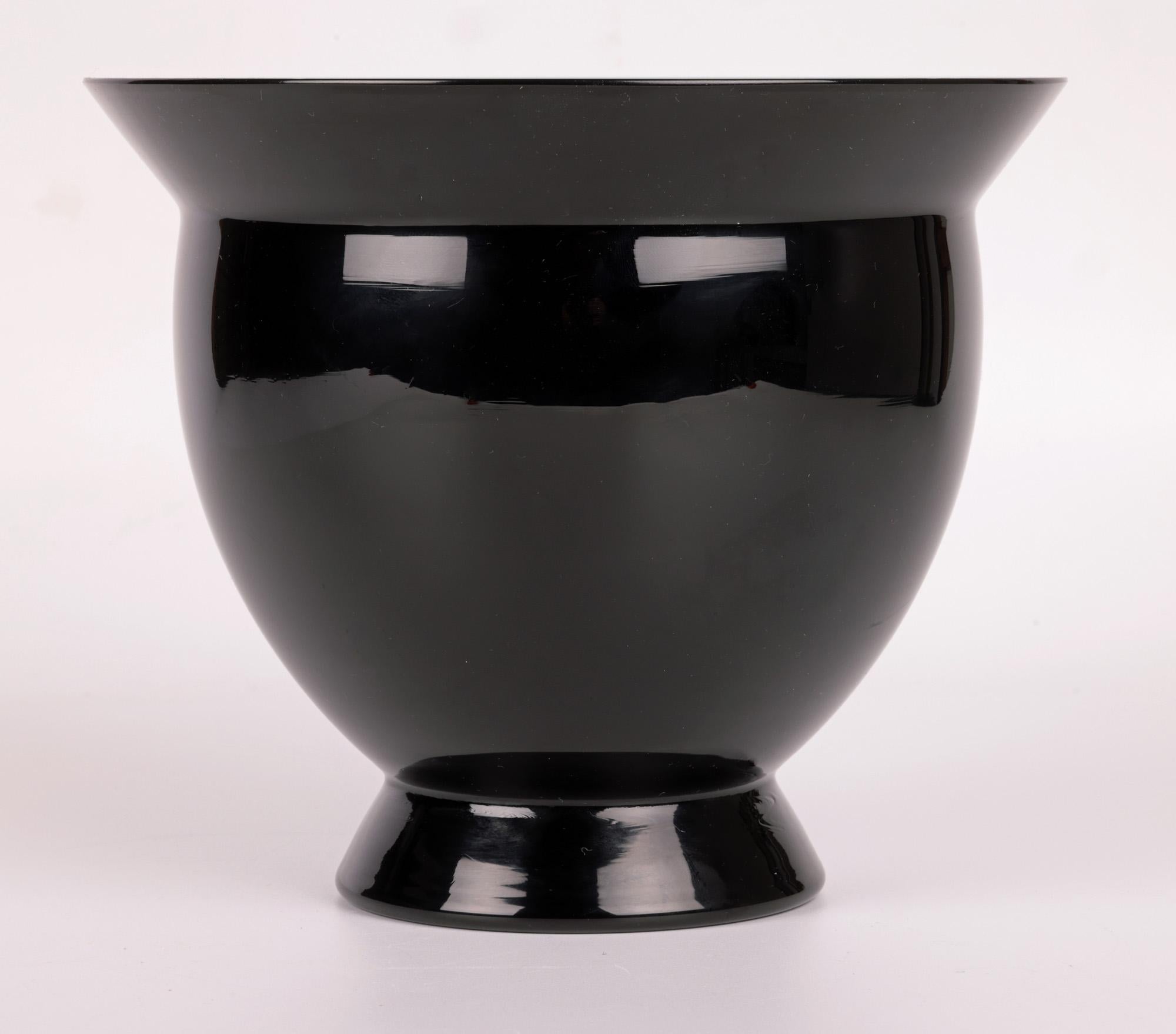A very stylish and beautifully hand-made Venetian Murano art glass vase in green and white glass cased in a mirror black glass finish produced by renowned glass makers Venini and designed by renowned glass designer Allessandro Mendini (Italian,