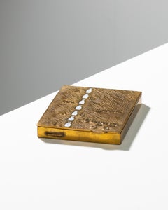 “Allez laissez couler les jours”, gilt bronze compact by Line Vautrin