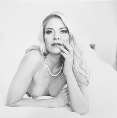 Topless blonde with pearls