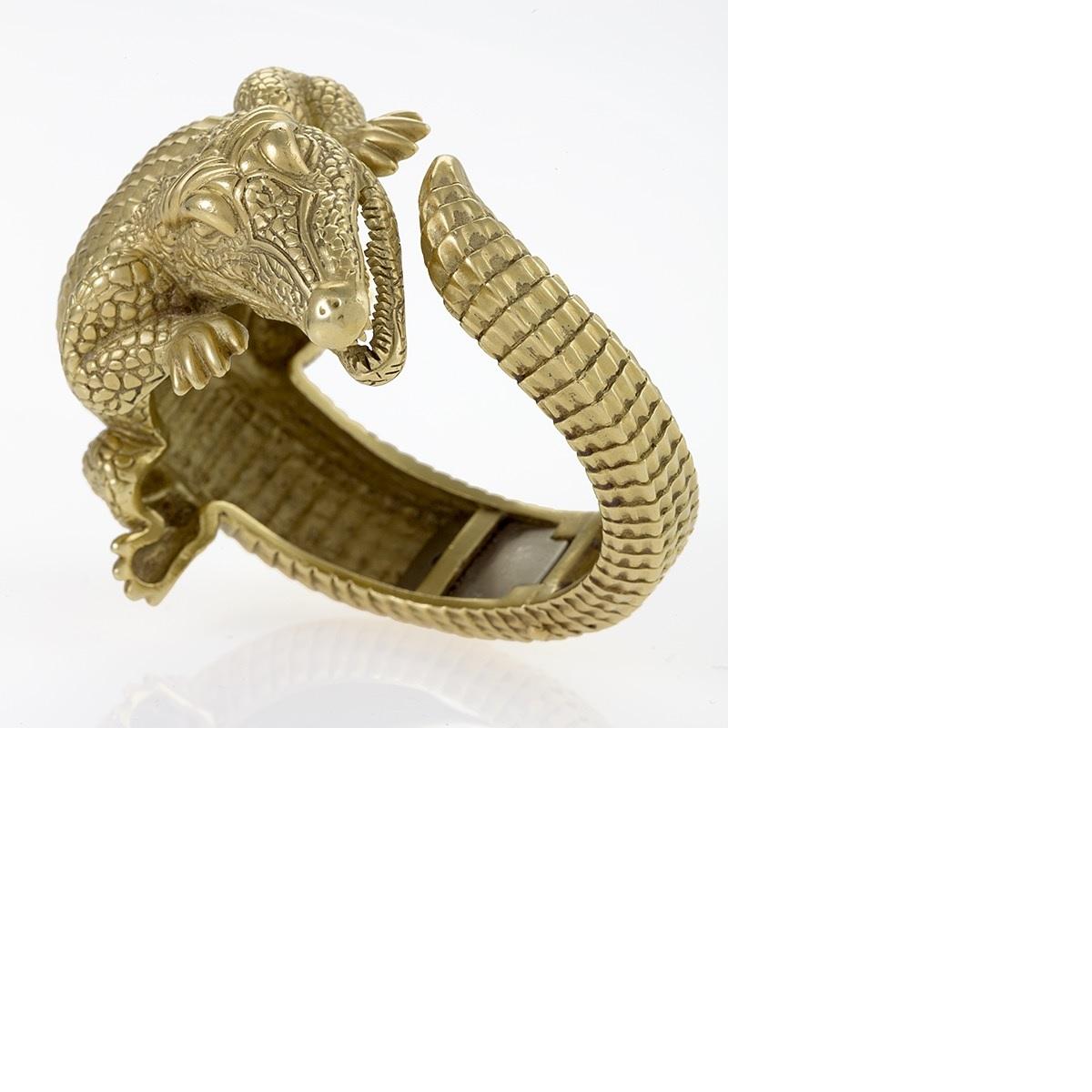 An American late-20th century 18 karat green gold alligator bangle bracelet by American icon Barry Kieselstein-Cord. This particular bracelet, a rare example of the animal cuff in its highly-sought-after 18 karat green gold coloration and the