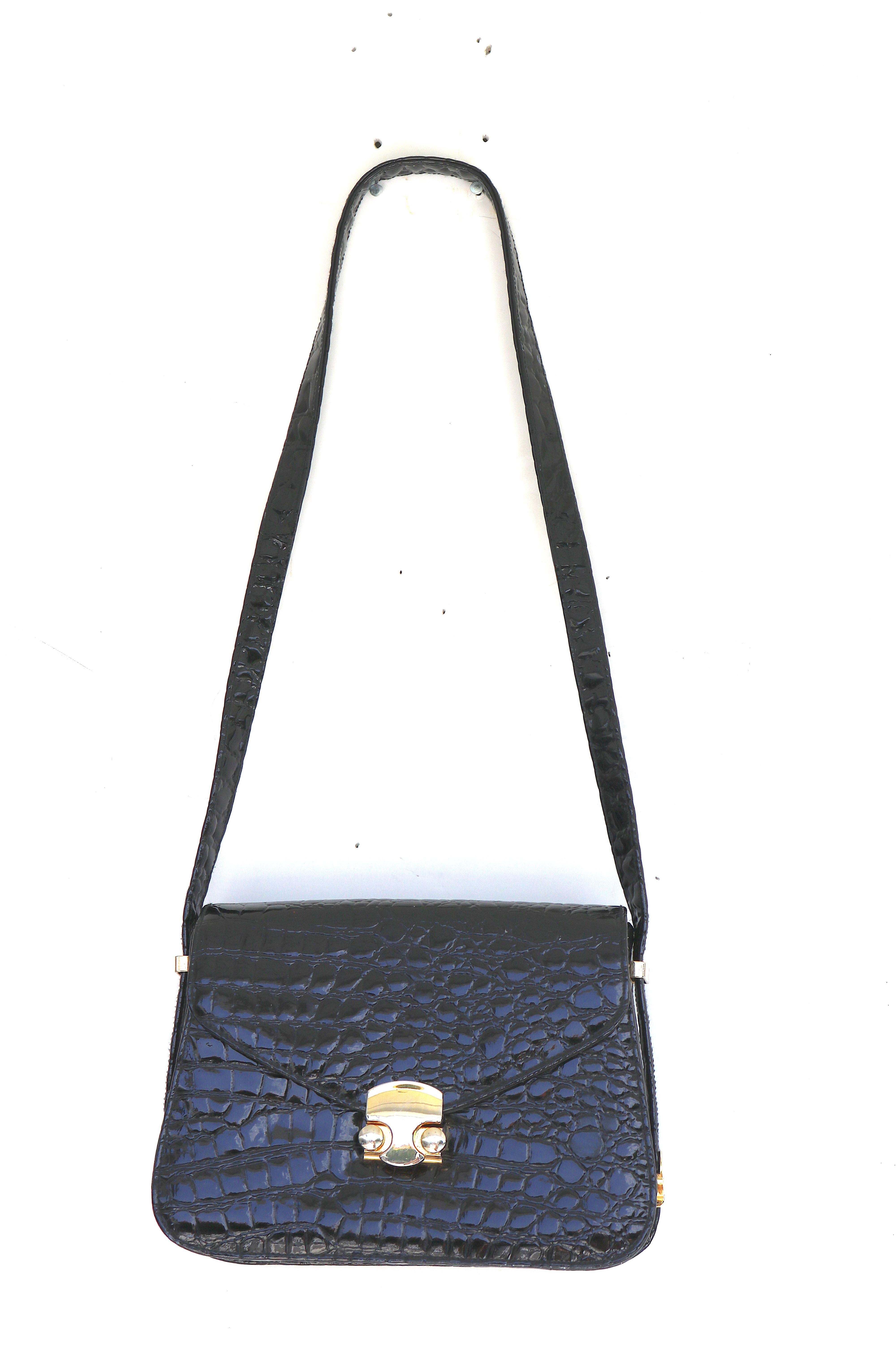 Vintage Gucci Style Sophisticated Lustrous Faux Black Alligator Handbag with a Unique Method of Shortening and Lengthening the Strap- the side hardware disconnects-the two sides meet in the bottom of the bag, creating a short evening appropriate