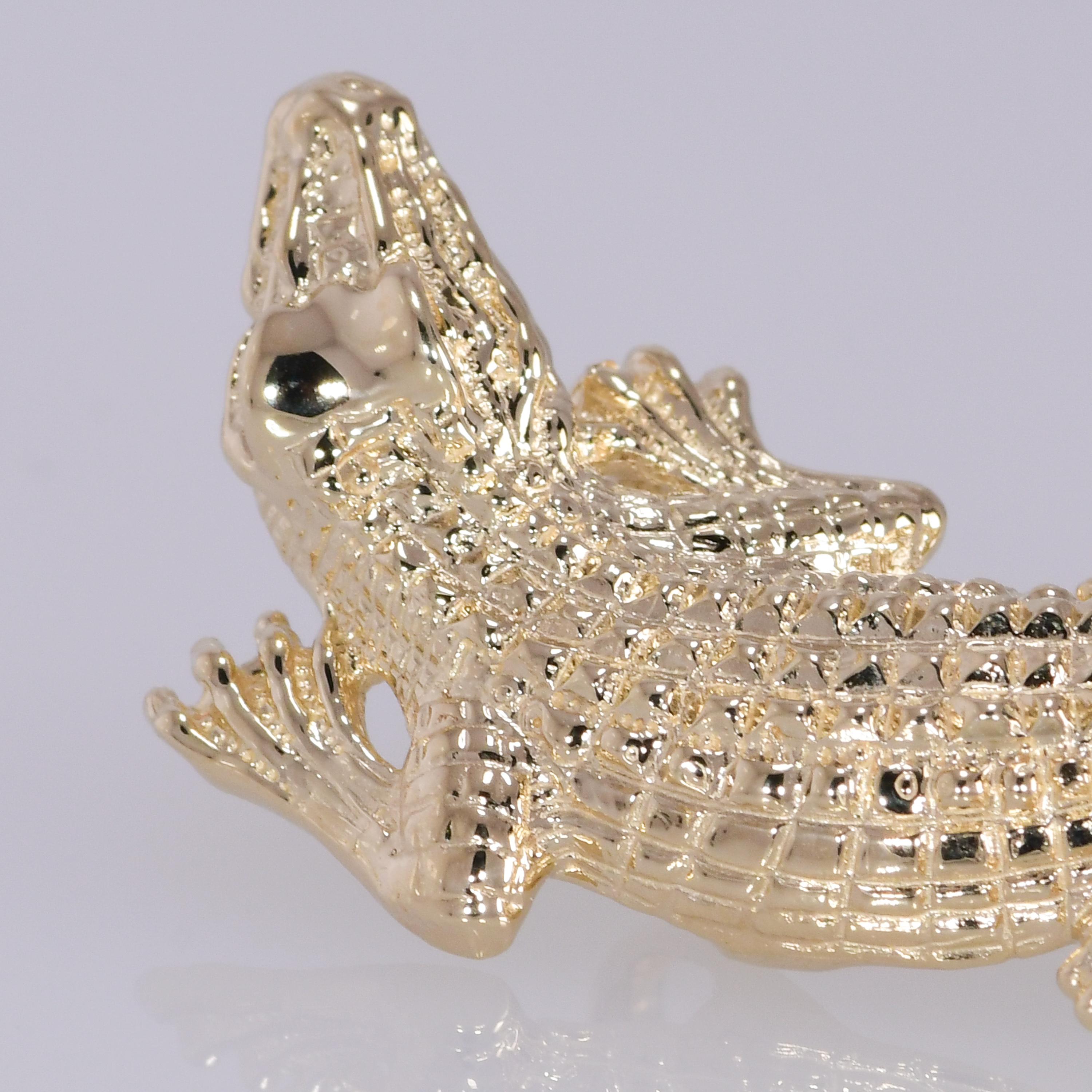 Alligator Yellow Gold 14K Slide Pendant 7.70 grams
Metal: Yellow Gold 
Purity: 14K 
Style: Slide Pendant 
Total Gram Weight: 7.70 grams
The alligator has excellent detail and measures 1 5/8 