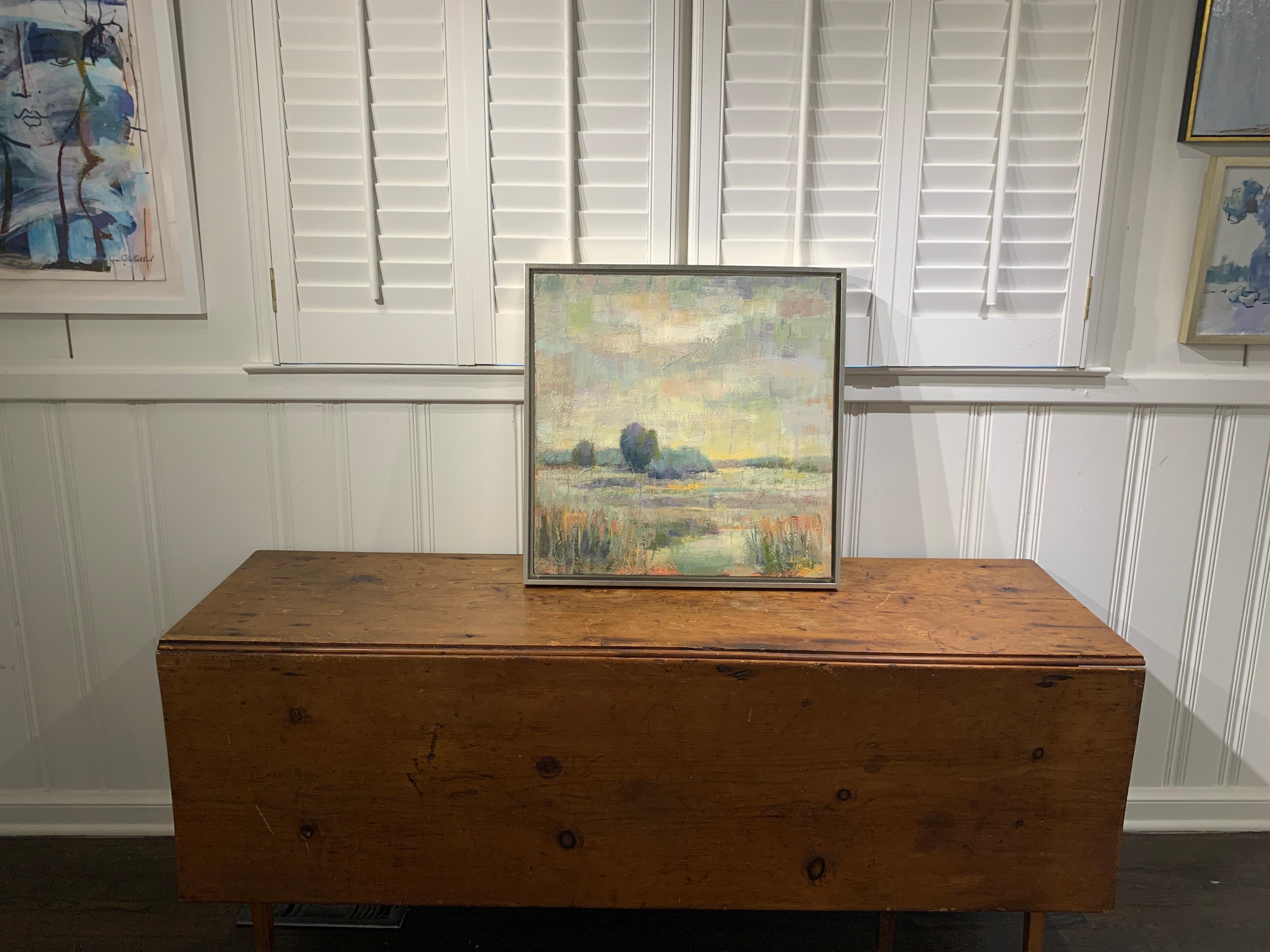 'Storms are Lifting' is a framed landscape oil on canvas painting of medium size, created by American artist Allison Chambers in 2020. Featuring a low country marsh scene in a palette made of a variety of colors such as blue, green, pink, purple and