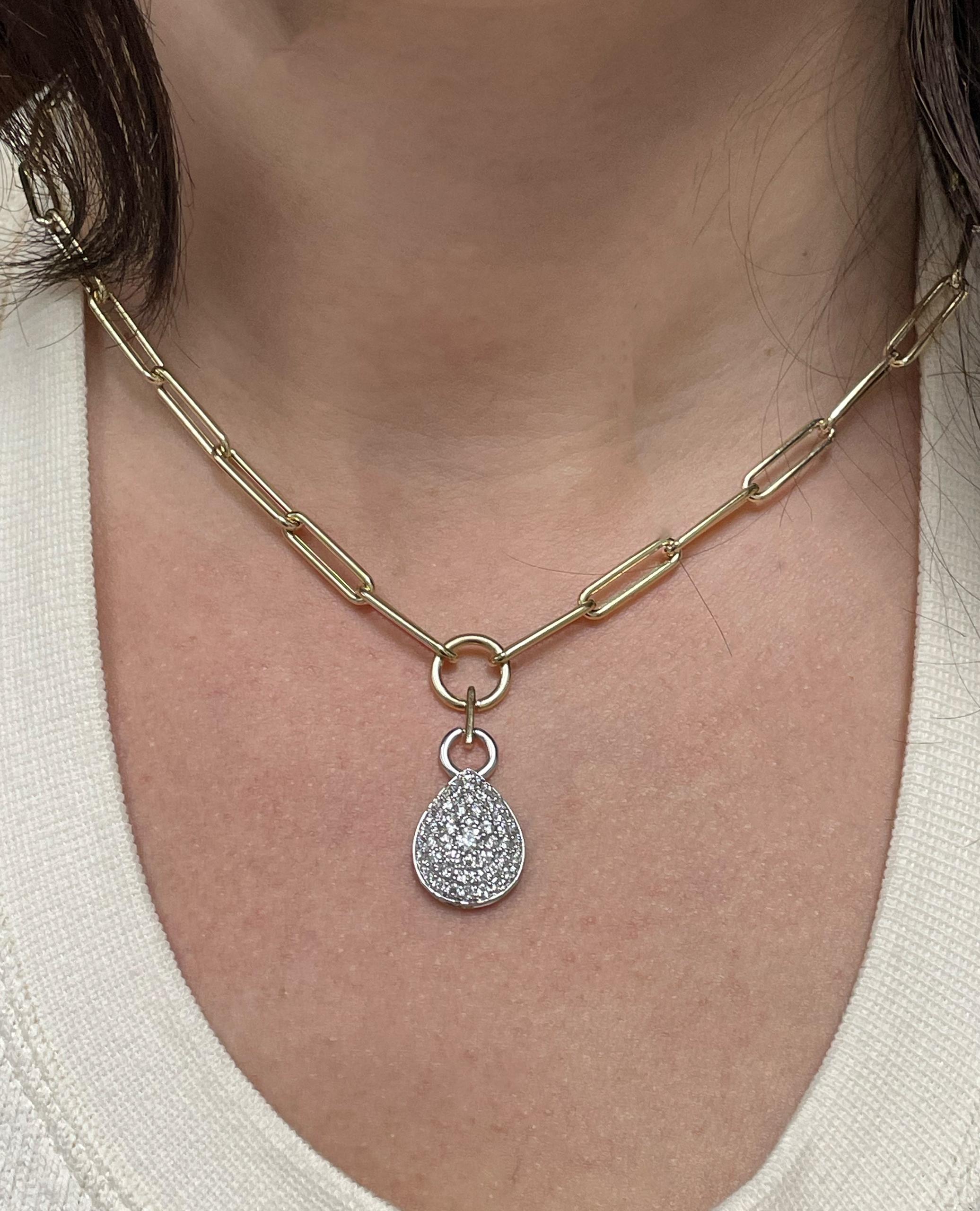 Allison Kaufman 14K two tone paperclip chain necklace with pear shaped pendant furnished with round diamonds weighing 1.26 carats total.  

* Diamonds are G color, SI2 clarity.  
* Necklace has a lobster lock.
* Necklace is 17 inches long and can be