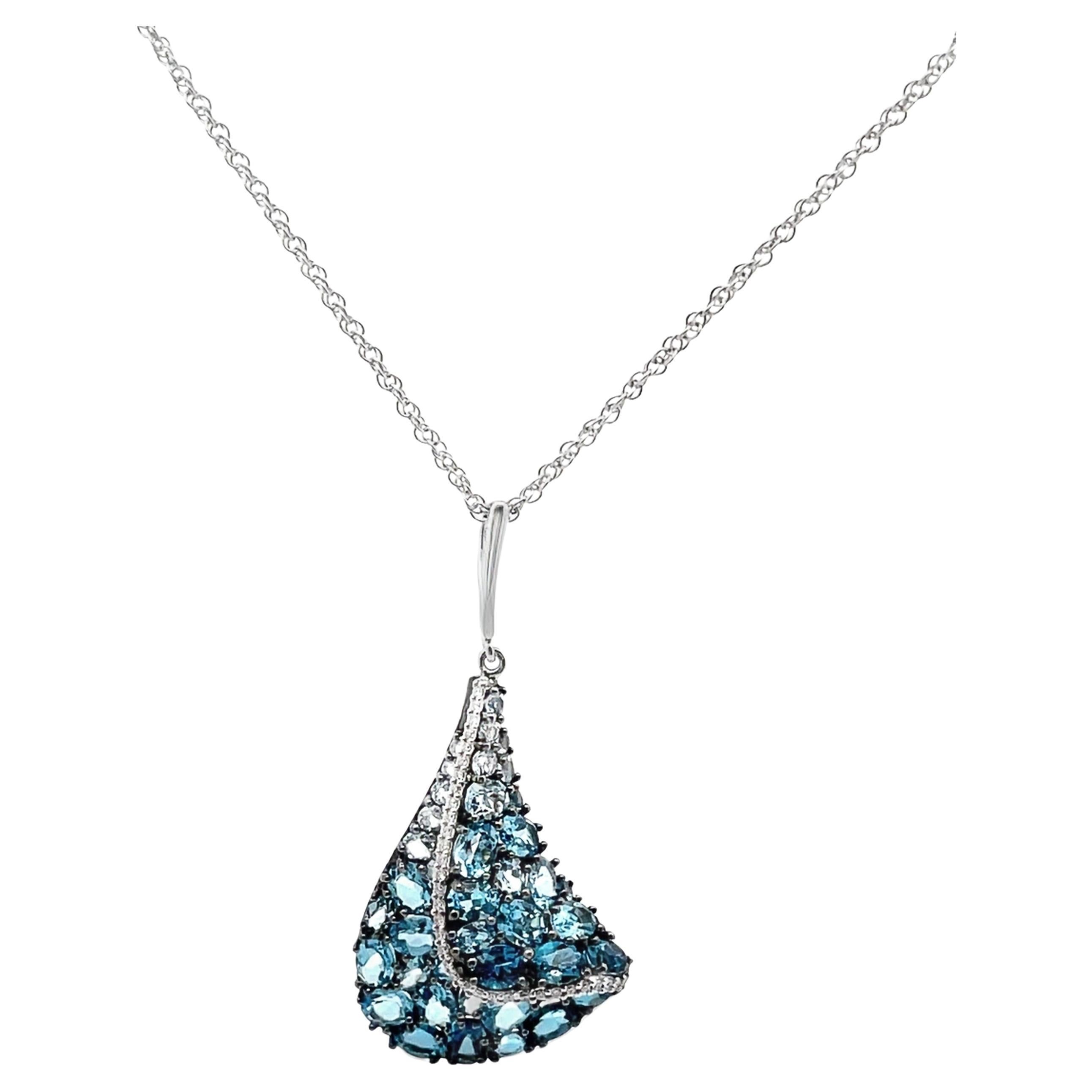 Allison Kaufman 14K white gold pendant necklace with round faceted diamonds weighing 0.13 carat total and multi-shade blue topaz weighing 4.81 carats total.  

- Necklace is 18 inches long.
- Diamonds are G color, SI2 clarity.
