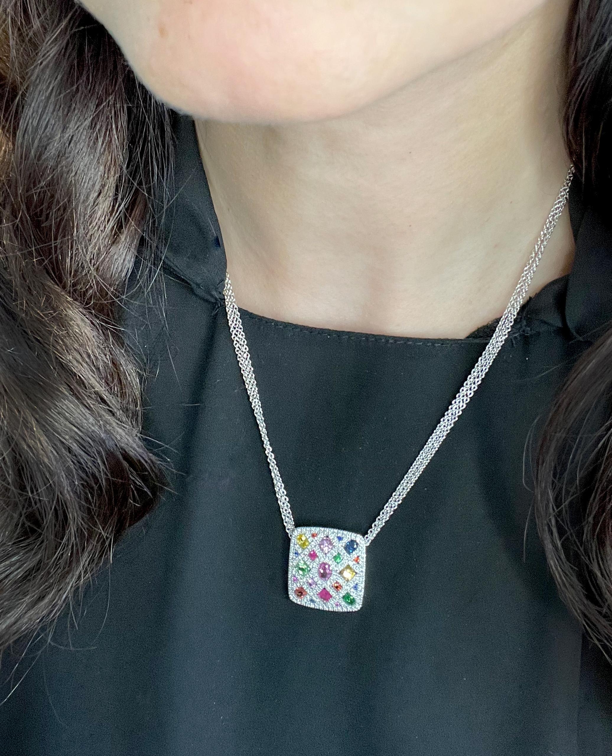 Allison Kaufman 14K white gold square shaped pendant with diamonds totaling 0.63 carats and multi colored sapphires, ruby and garnet totaling 2.59 carats total weight. The pendant slides on a 16 inch 14K white gold triple chain with a lobster clasp.
