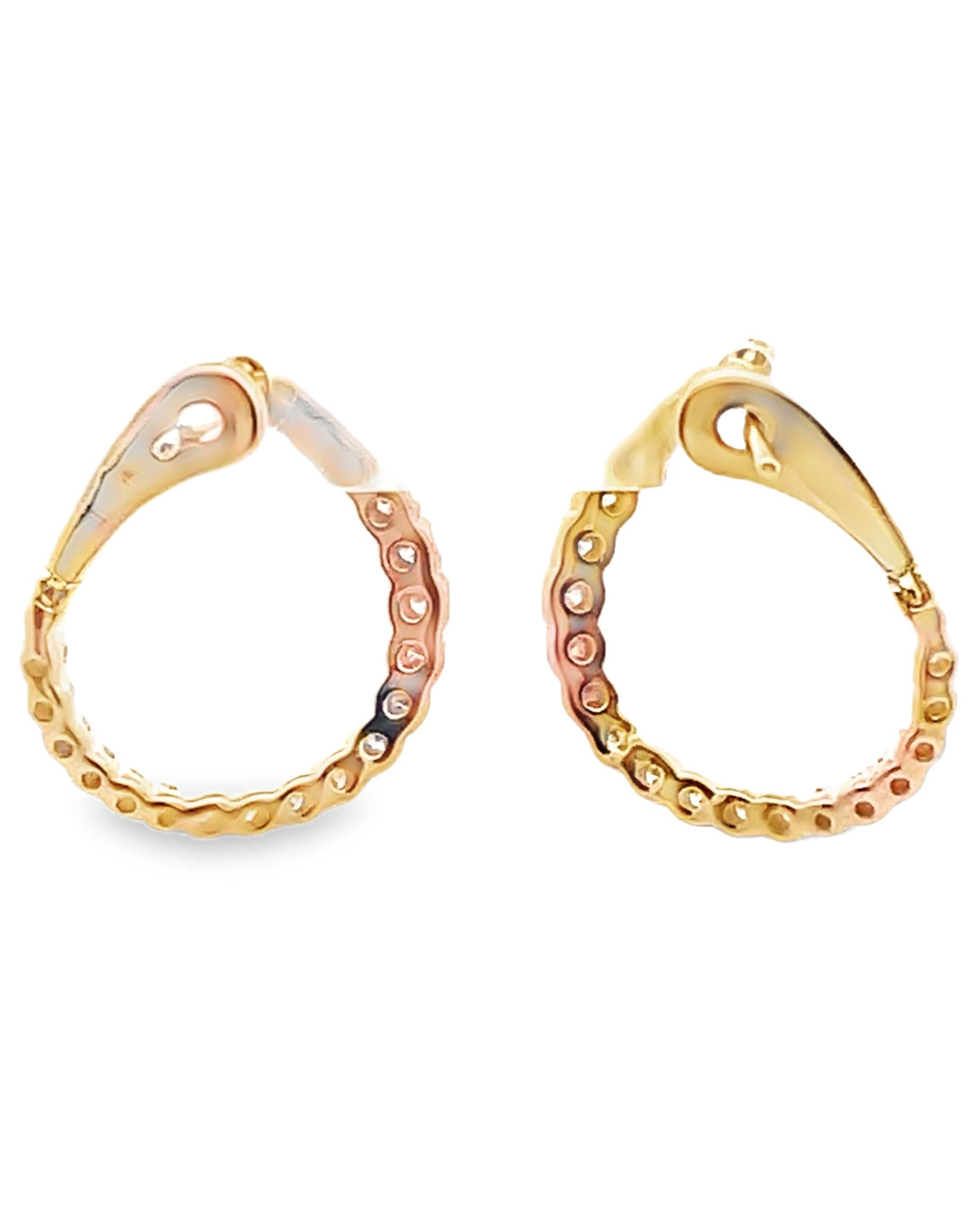 Allison Kaufman 14K yellow gold hoop earrings with diamonds weighing 0.50 carat total.  

- Diamonds are G color, SI3 clarity