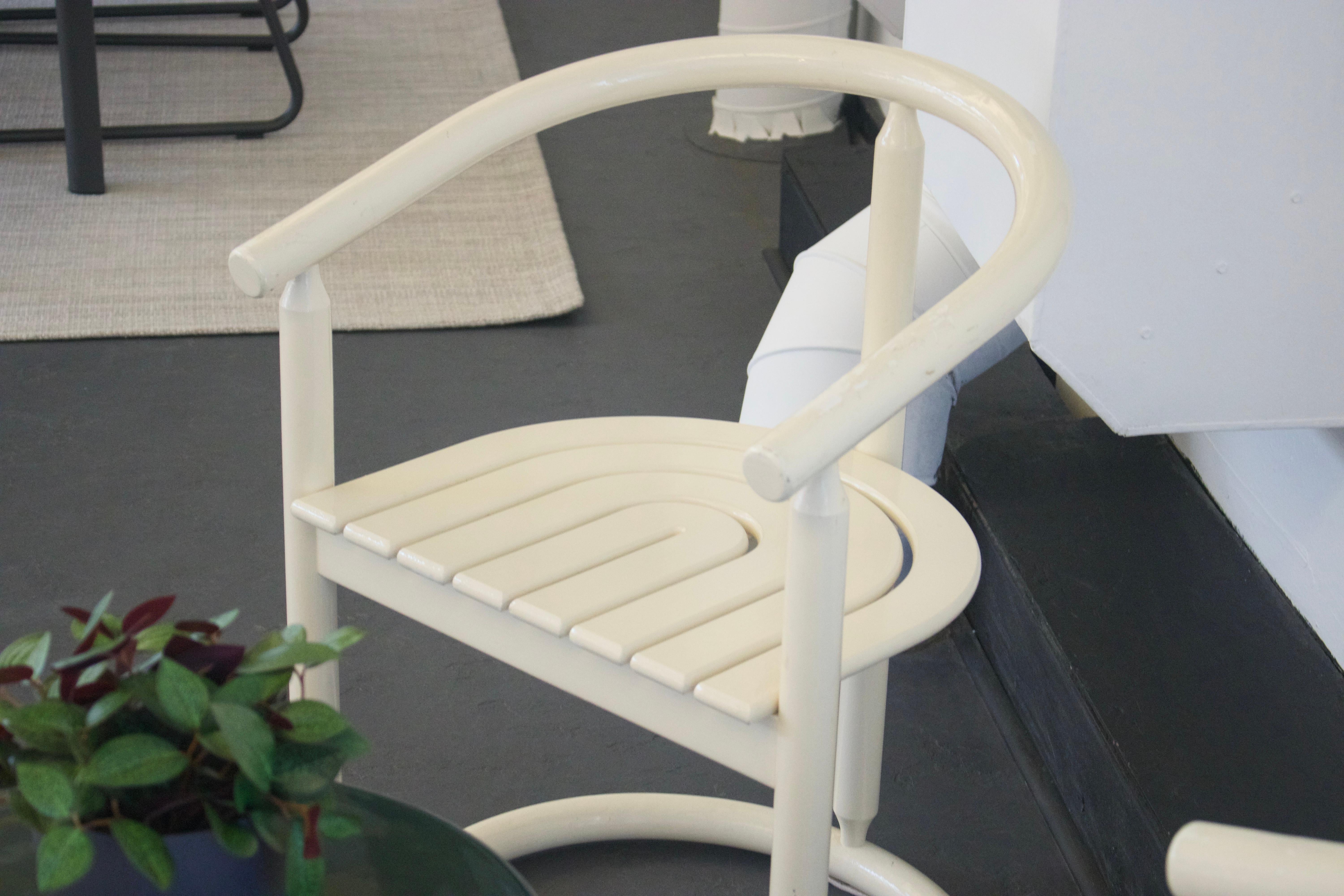 These striking bentwood dining chairs from the 1980s showcase the enduring appeal of minimalist Scandinavian design. Crafted with graceful curved wooden frames finished in pristine white lacquer, each chair features the distinctive horseshoe-shaped