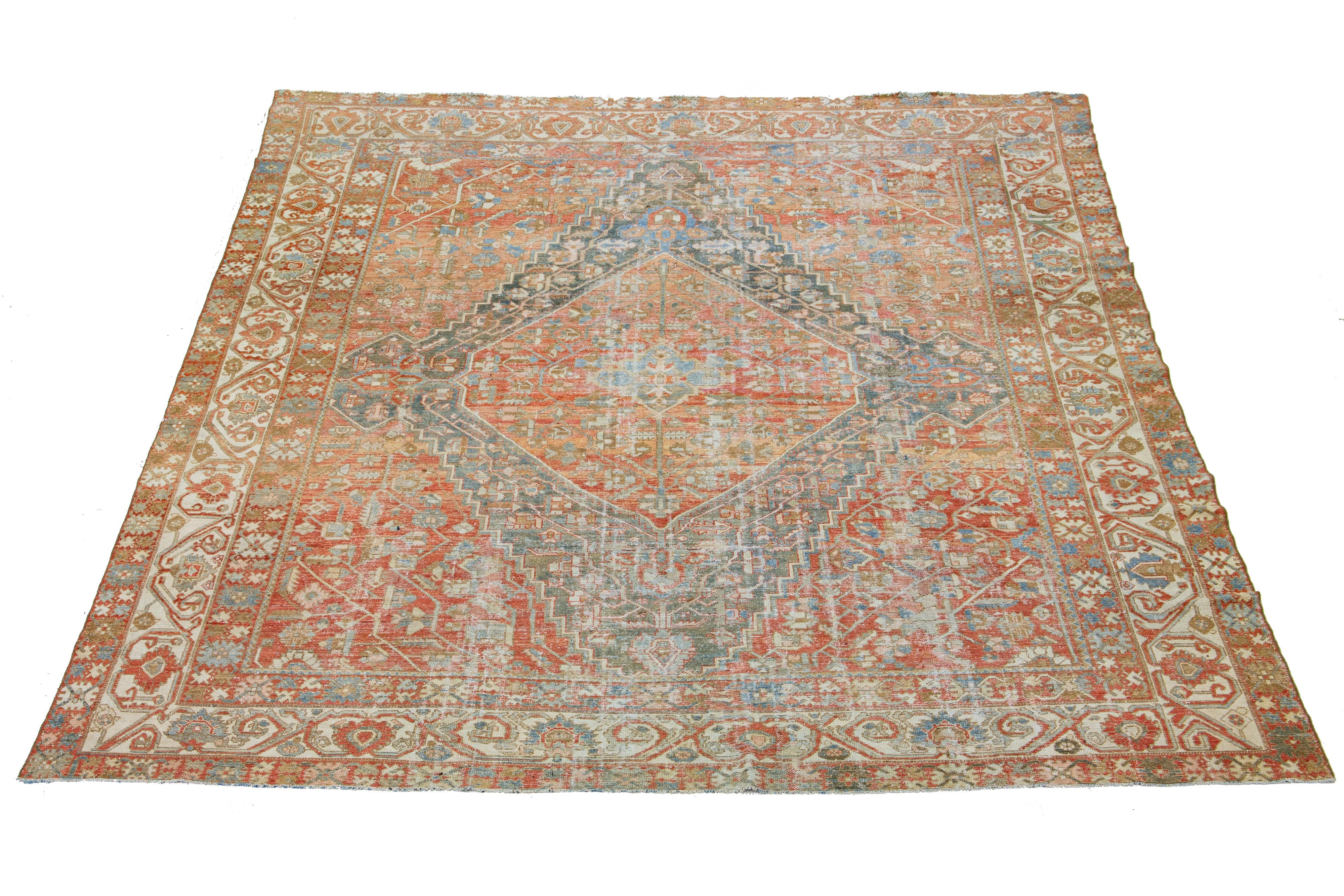 Beautiful Antique Bakhtiari hand-knotted wool rug with a red-rust color field. This Persian piece has a classic geometric floral design in beige and blue colors.

This rug measures 11' x 12'5