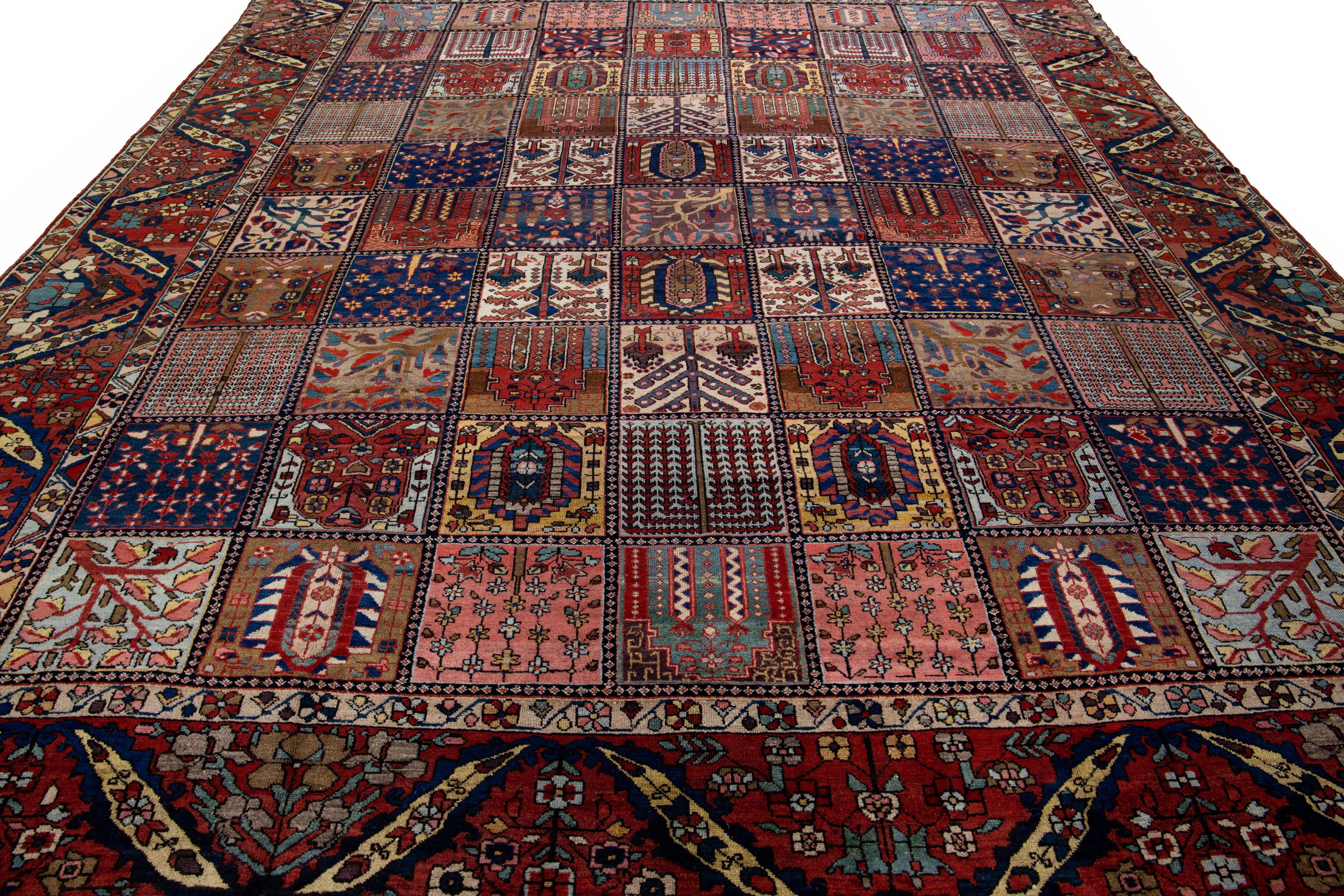 Beautiful Antique Bakhtiari hand-knotted wool rug with a rust color field. This Persian piece has an all-over classic multicolor pattern design.

This rug measures 11'7