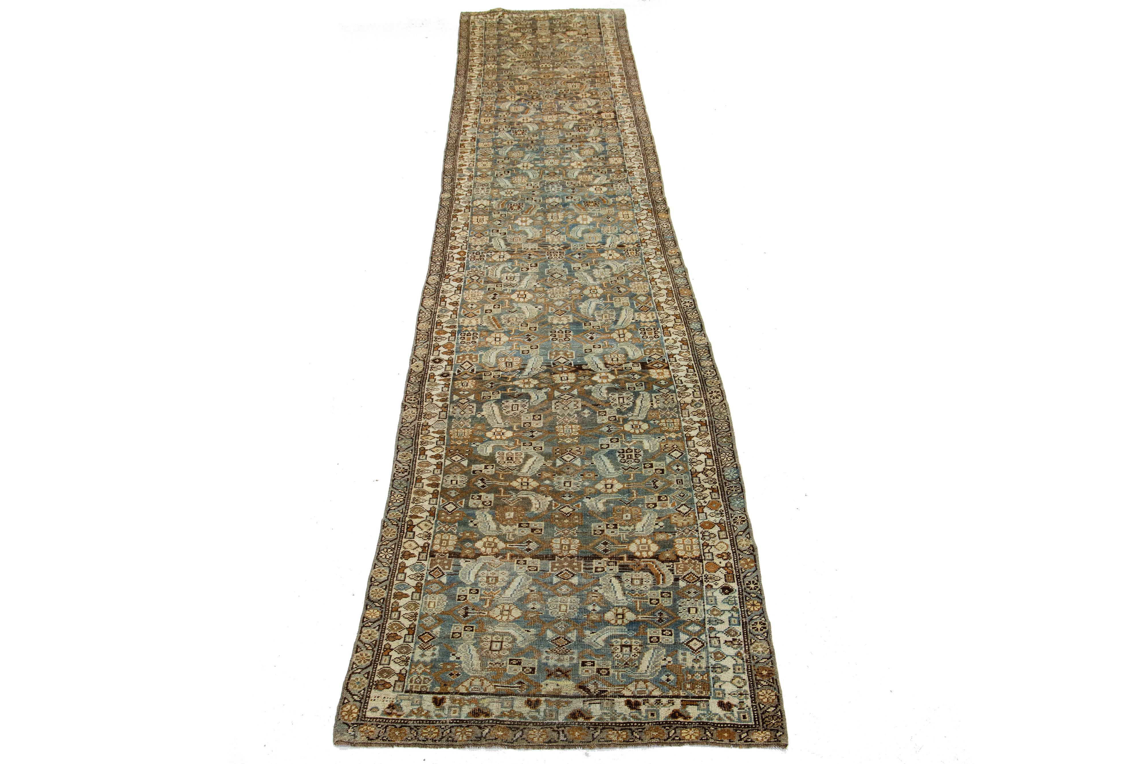 Beautiful antique Bidjar hand-knotted wool runner with a blue color field. This Bidjar rug has a designed frame with beige, orange, and brown accents in a gorgeous all-over design.

This rug measures 3'4