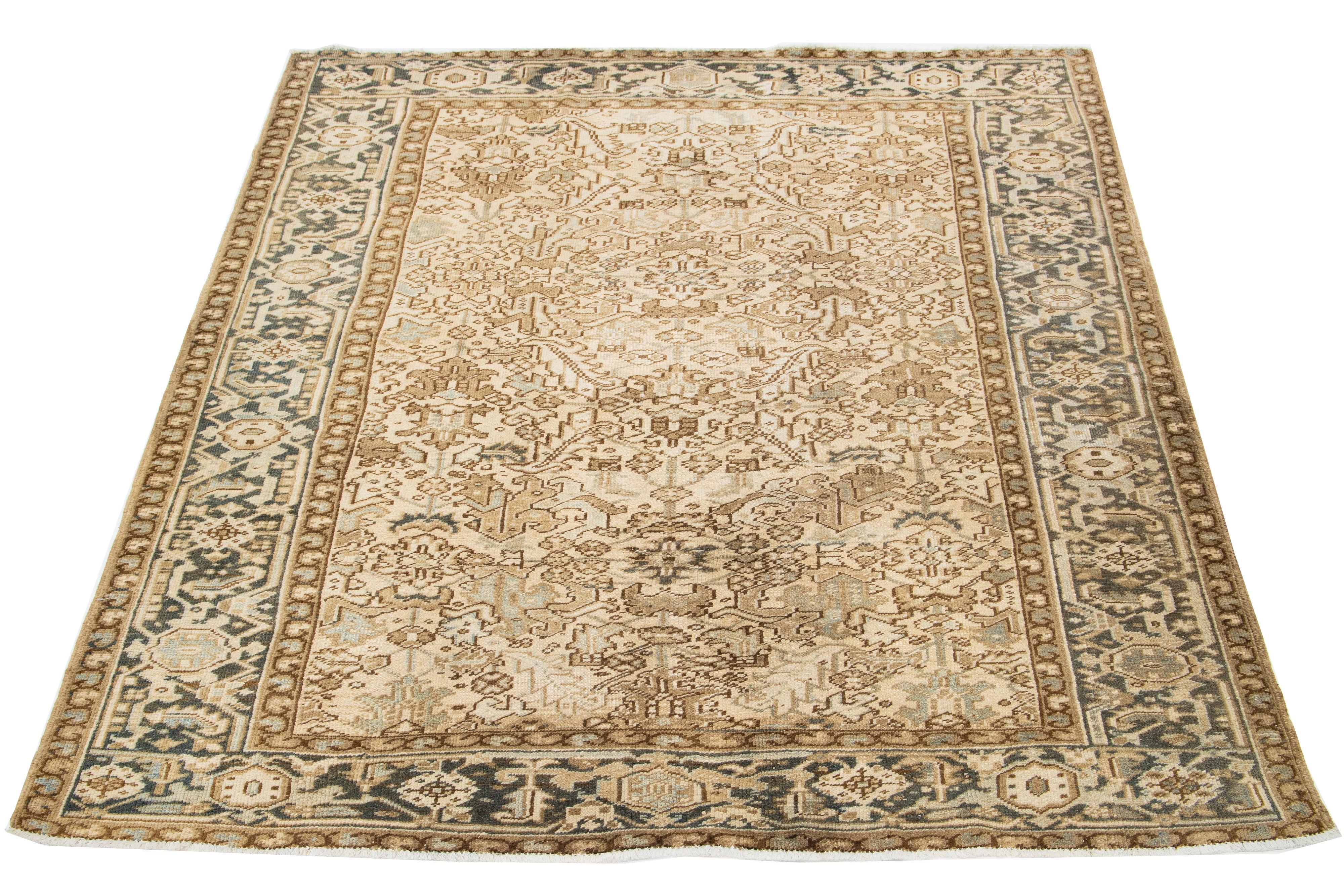 Antique Persian Heriz rug, hand-knotted wool, blue and light brown all-over pattern on a beige field.

This rug measures 7'3' x 8'7