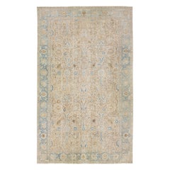Tappeto antico in lana Tabriz persiano del 1910 con disegno a trifoglio in beige