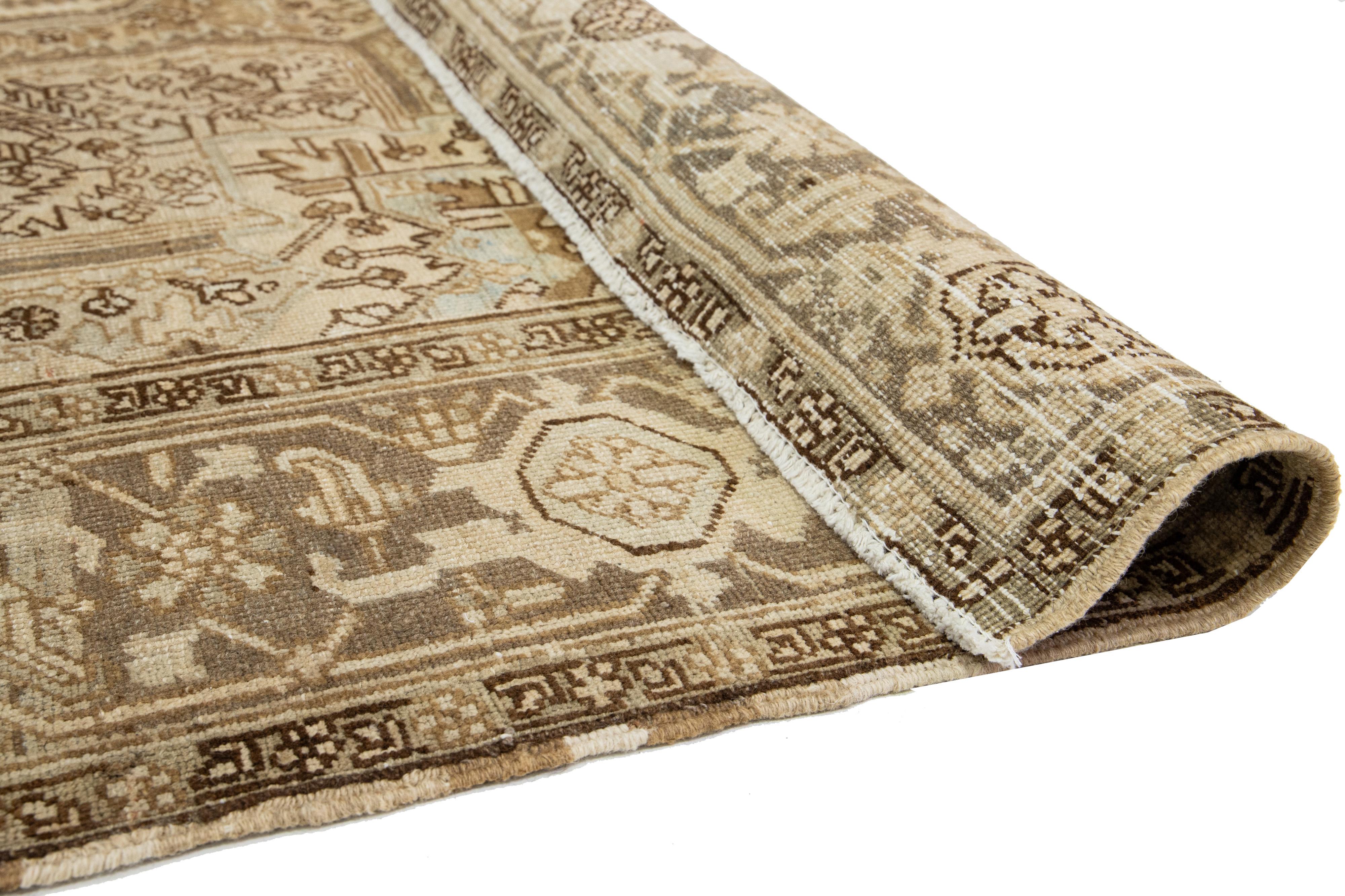 Heriz Serapi  Allover Designed Persian Heriz Antique Wool Rug In light Brown From The 1920s For Sale