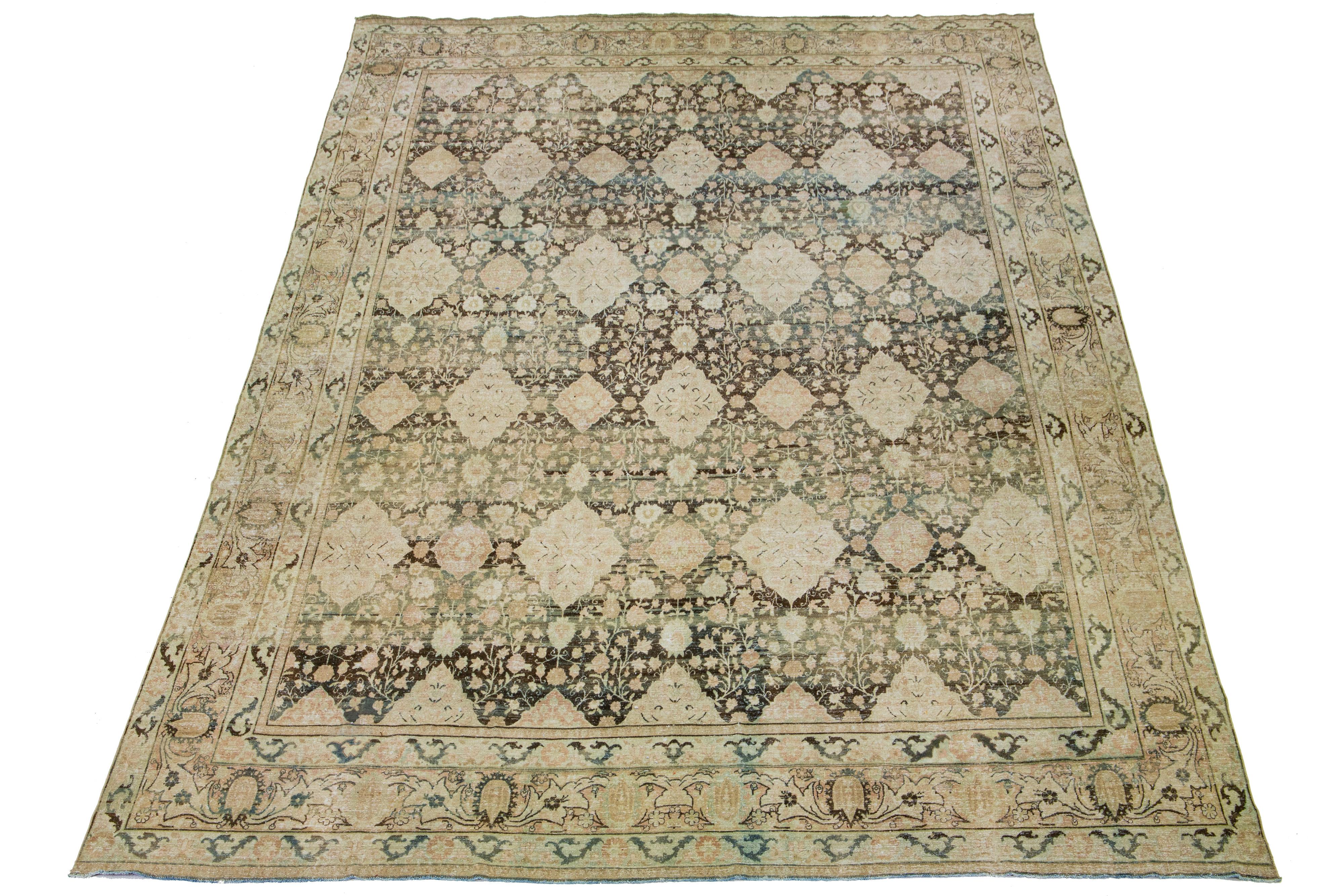This exquisite wool rug from Kerman is hand-knotted and features a charming antique finish. The carpet has a warm brown color and a stunning all-over rosette pattern. Hints of rich blue and rust add beauty to this remarkable piece of Persian