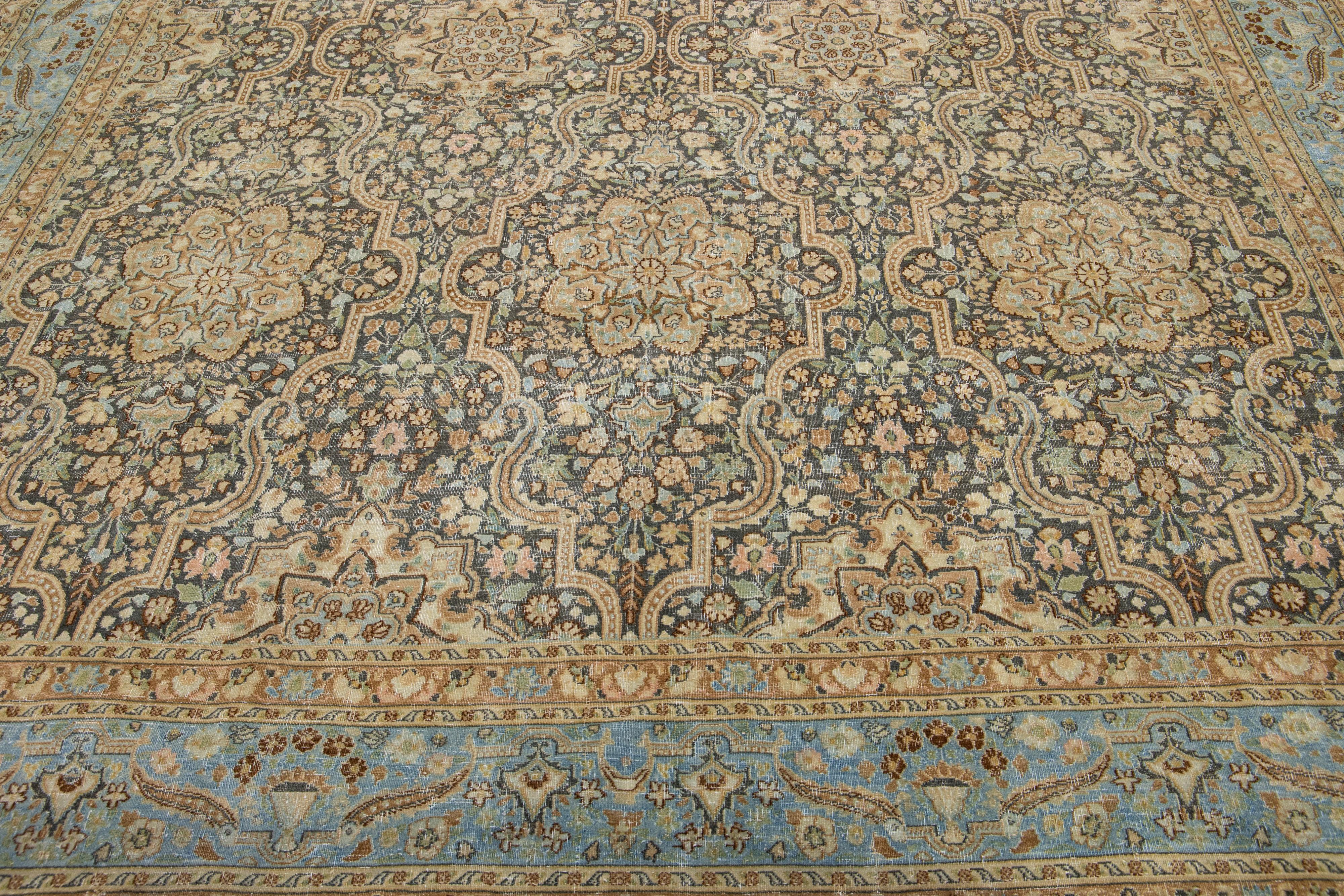 This vintage Tabriz rug boasts a grey color field and features exquisite, hand-knotted wool construction complemented by hints of brown, peach, and blue in an all-over floral pattern.

This rug measures: 9'10