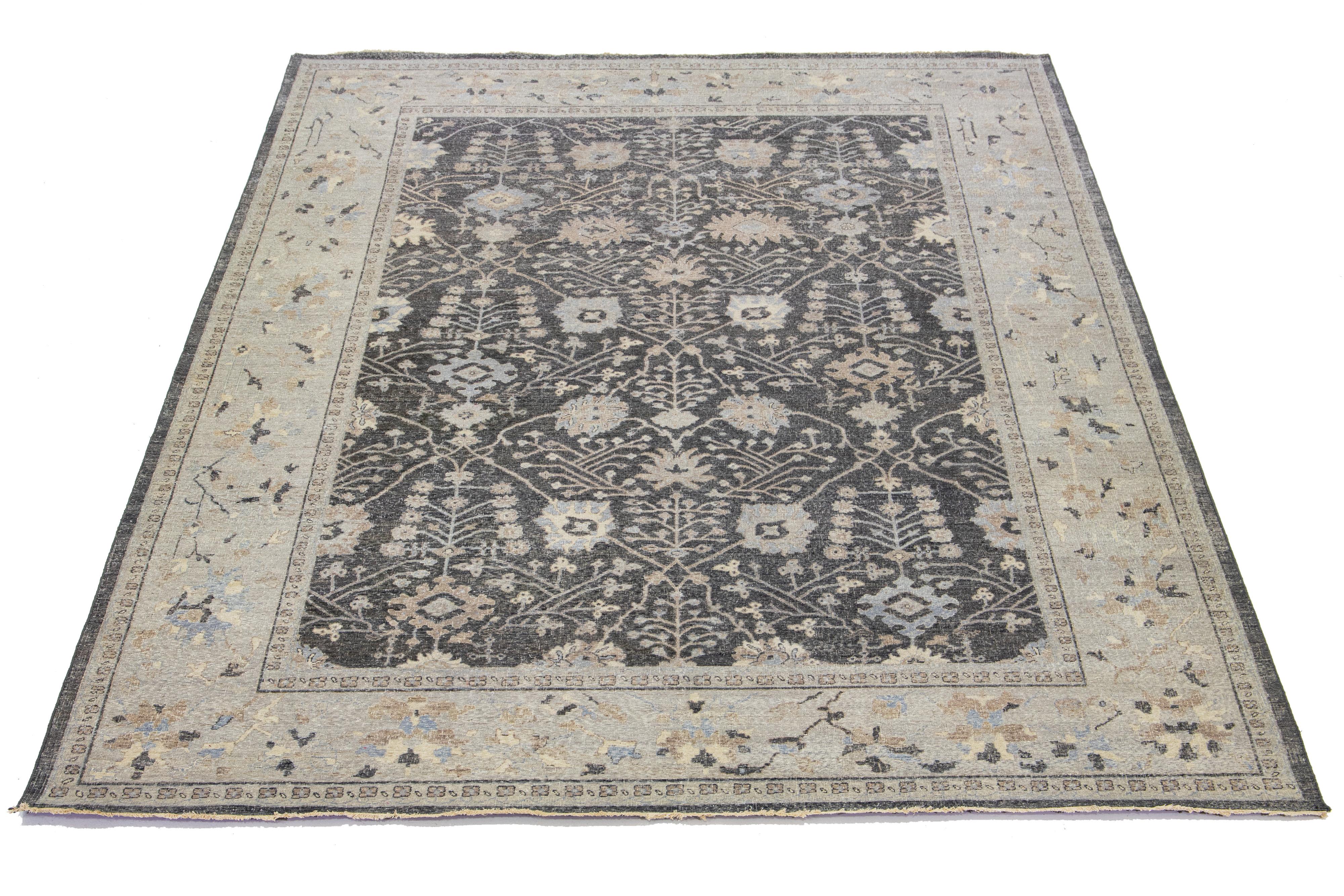 The Artisan line from Apadana adds a lovely antique touch to any room. This hand-knotted rug displays an enchanting all-over floral design, featuring a charcoal-gray color palette with accents of beige and brown.

This rug measures 9' 11