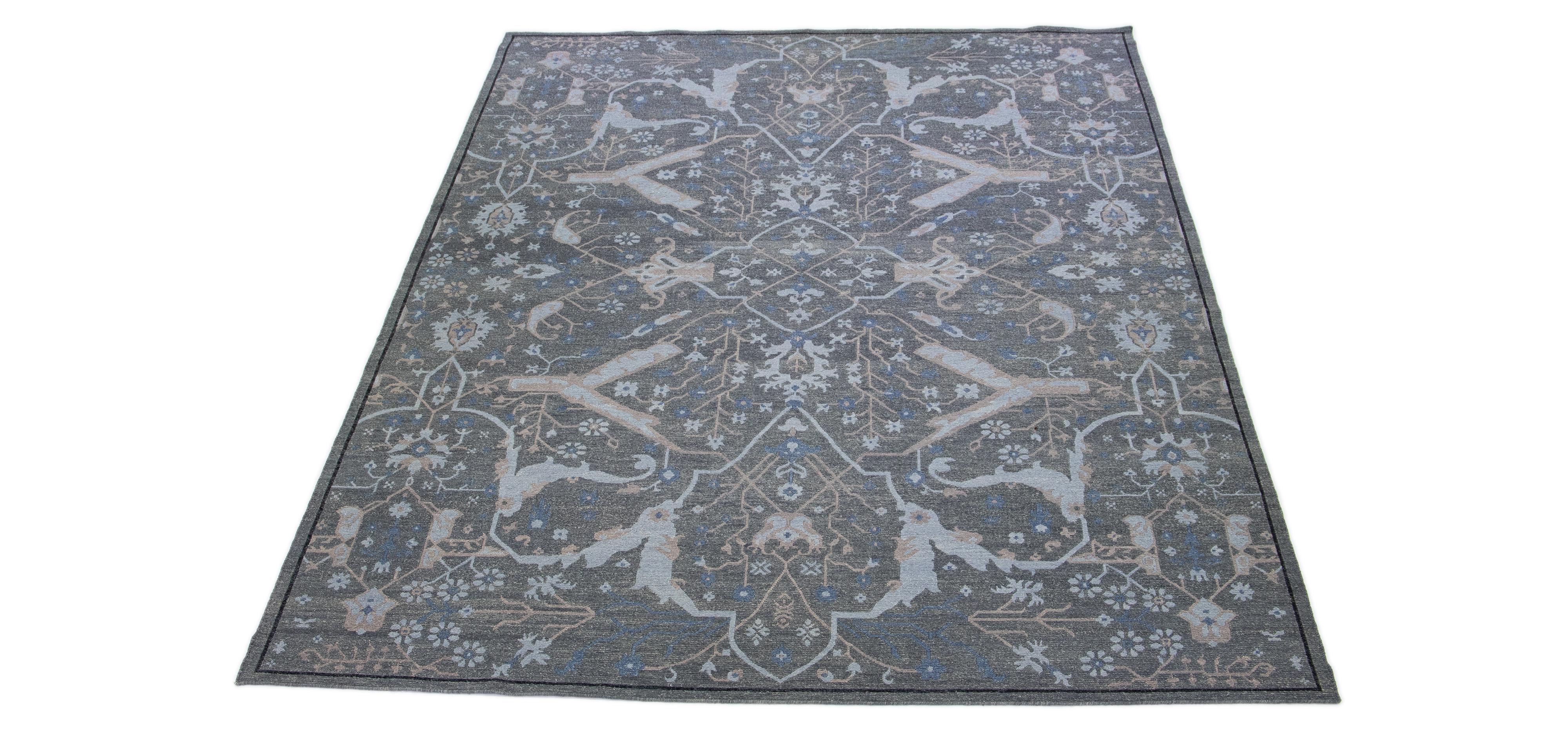 Beautiful Modern Soumak hand knotted wool rug with a gray field. This piece has accents in a gorgeous all-over geometric design in blue and brown.

This rug measures 10' x 13'9