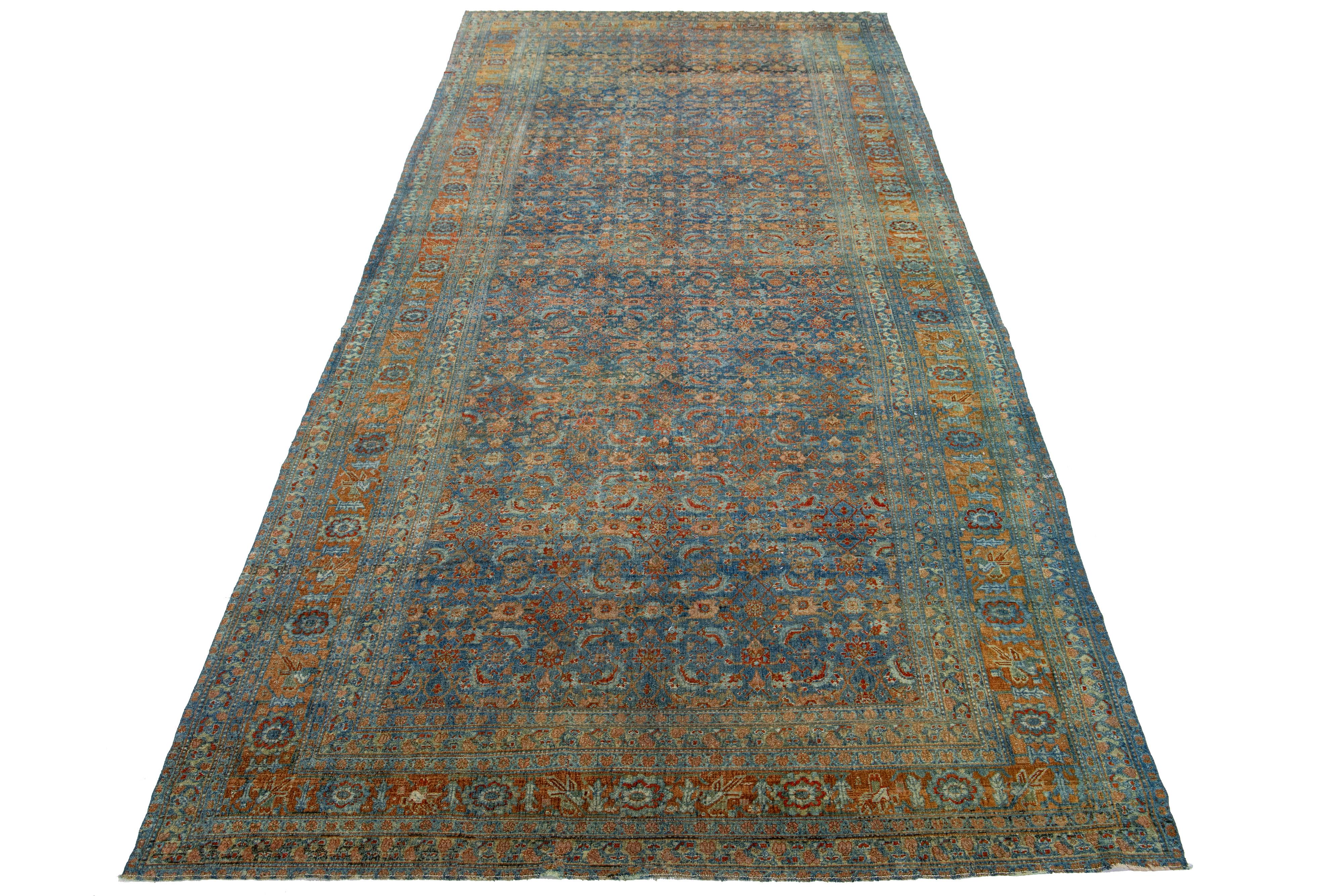 Beautiful antique Bidjar hand-knotted wool runner with a navy blue color field. This Bidjar rug has a designed rusted frame with peach accents in a gorgeous all-over floral design.

This rug measures 6'4