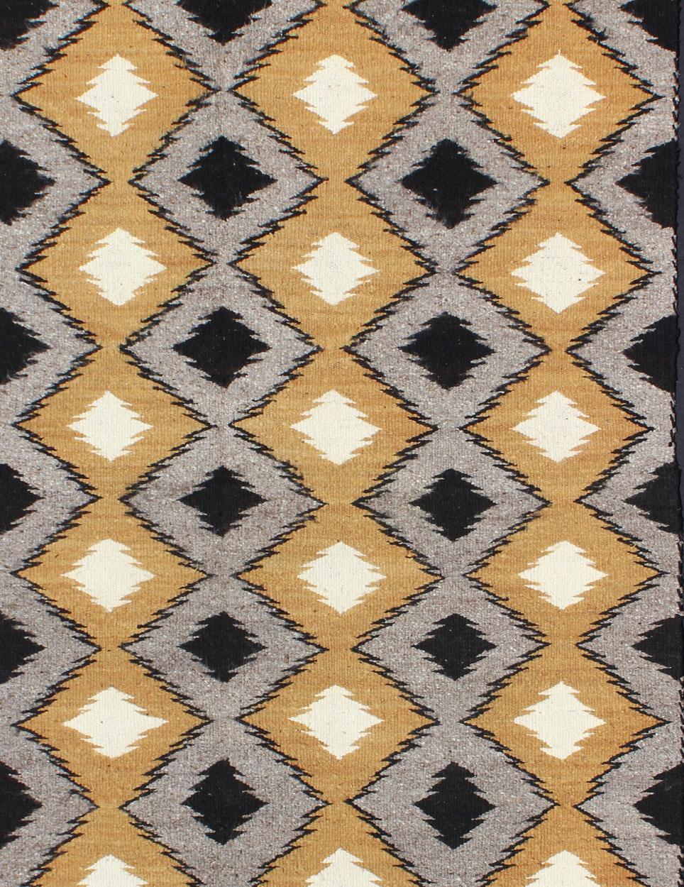 This intriguing antique Navajo Kilim, circa 1940 was woven in the United States during the first half of the 20th century. The exciting and unique composition boasts a captivating geometric composition with an all-over cross-shaped design. The range