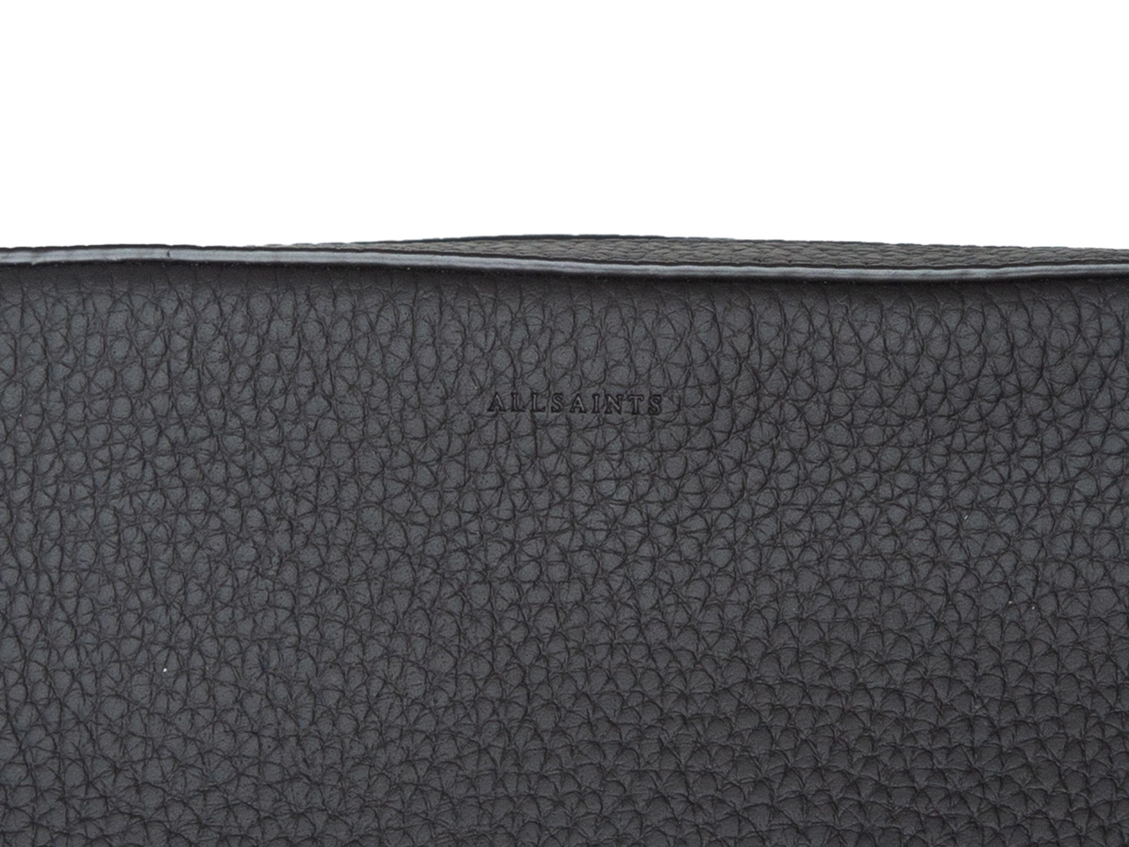 Product details: Black leather small crossbody bag by AllSaints. Silver-tone hardware. Zip closure pocket at back. Adjustable shoulder strap. Zip closure at top. 9