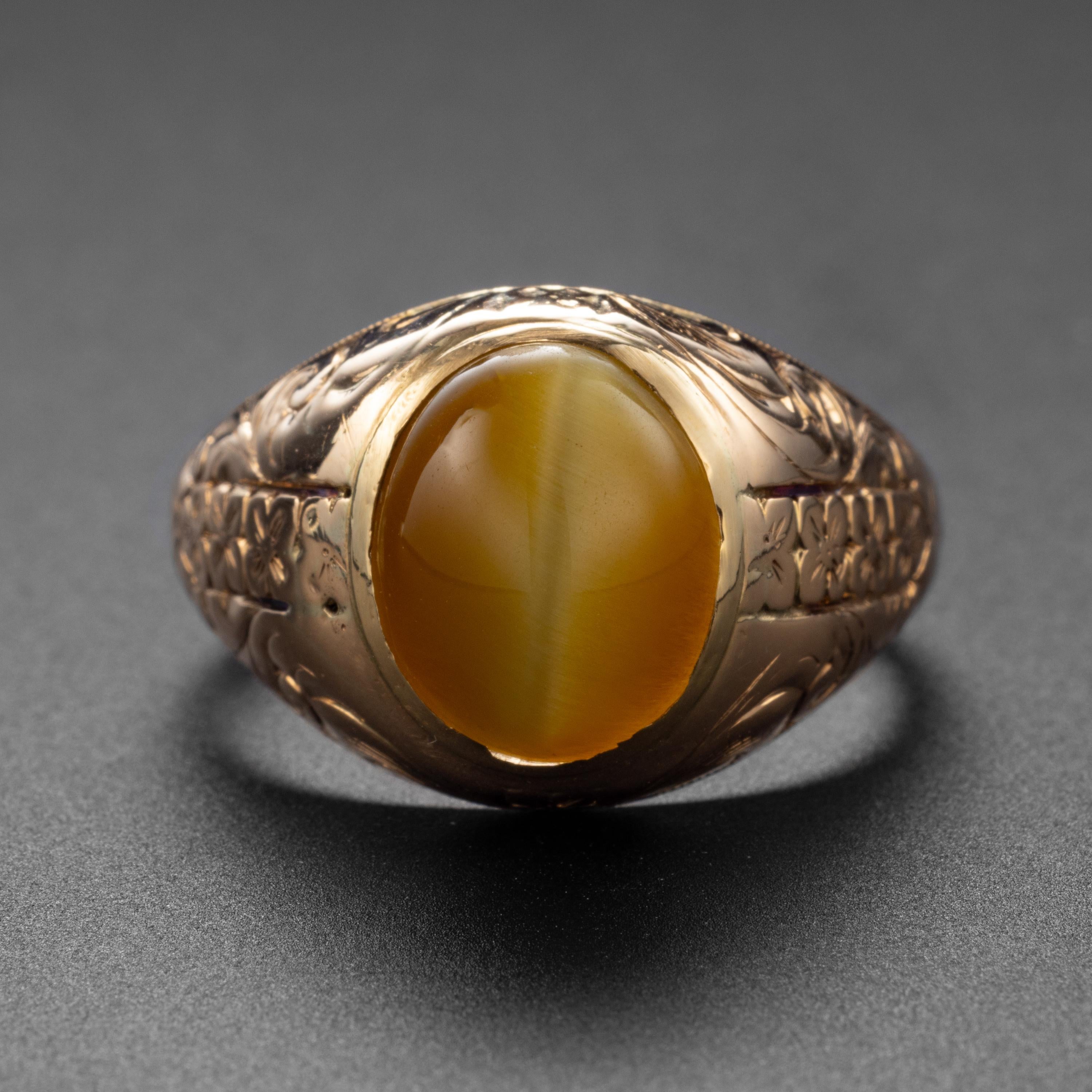 This Art Deco era (cica 1930s) 14K yellow gold hand-engraved ring was created by the venerable American jewelry manufacturer, Allsopp Bros. It features what is probably the finest tiger's eye cabochon I have ever encountered. 

Tiger's eye is