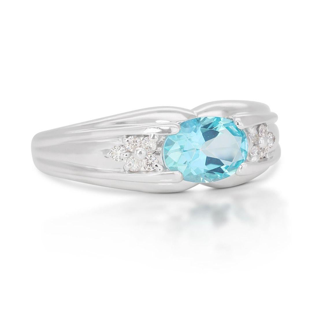 Oval Cut Alluring 0.96 Blue Topaz Ring with Side Diamonds in 18K White Gold For Sale