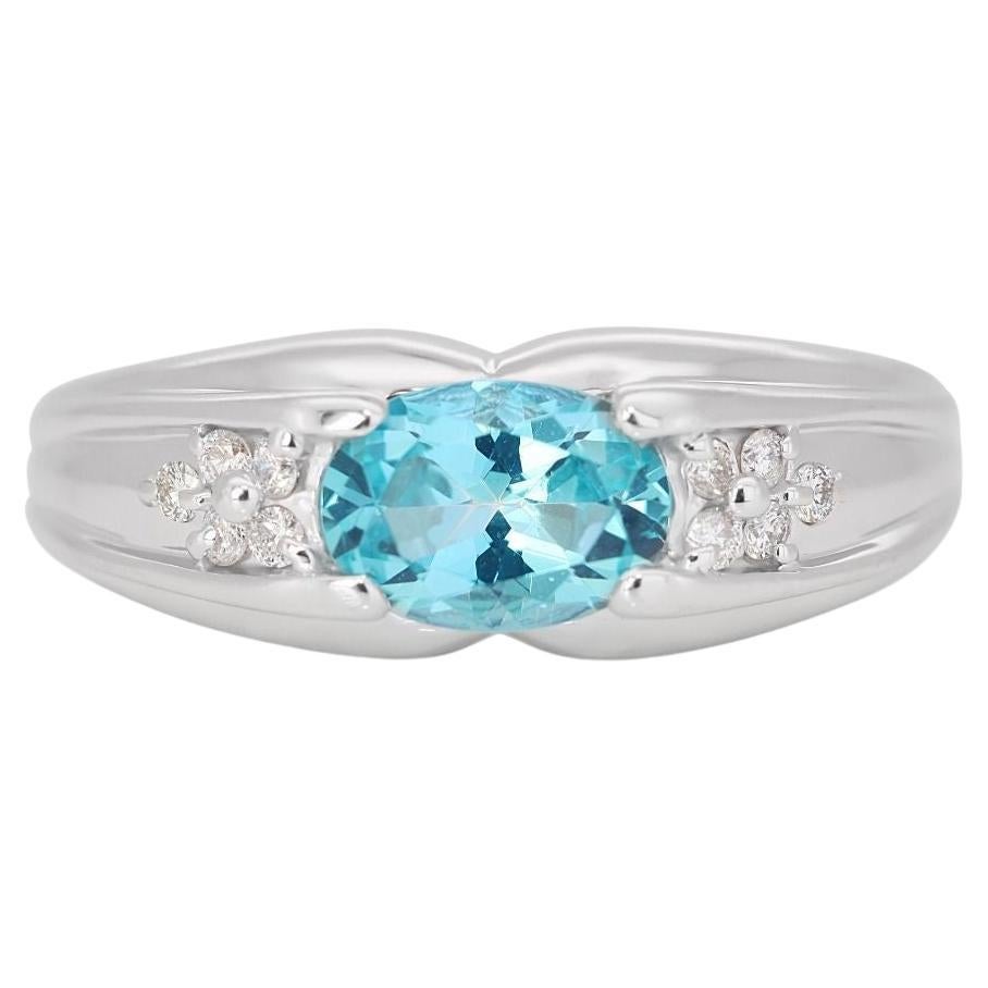 Alluring 0.96 Blue Topaz Ring with Side Diamonds in 18K White Gold For Sale