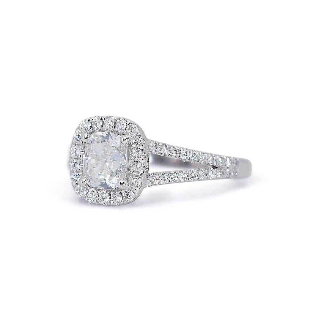 Alluring 1.30ct Diamonds Halo Ring in 18k White Gold - GIA Certified 

This exquisite diamond halo ring features a stunning 1.00-carat cushion cut center stone, meticulously set in gleaming 18k white gold. 58 sparkling round diamonds with a combined