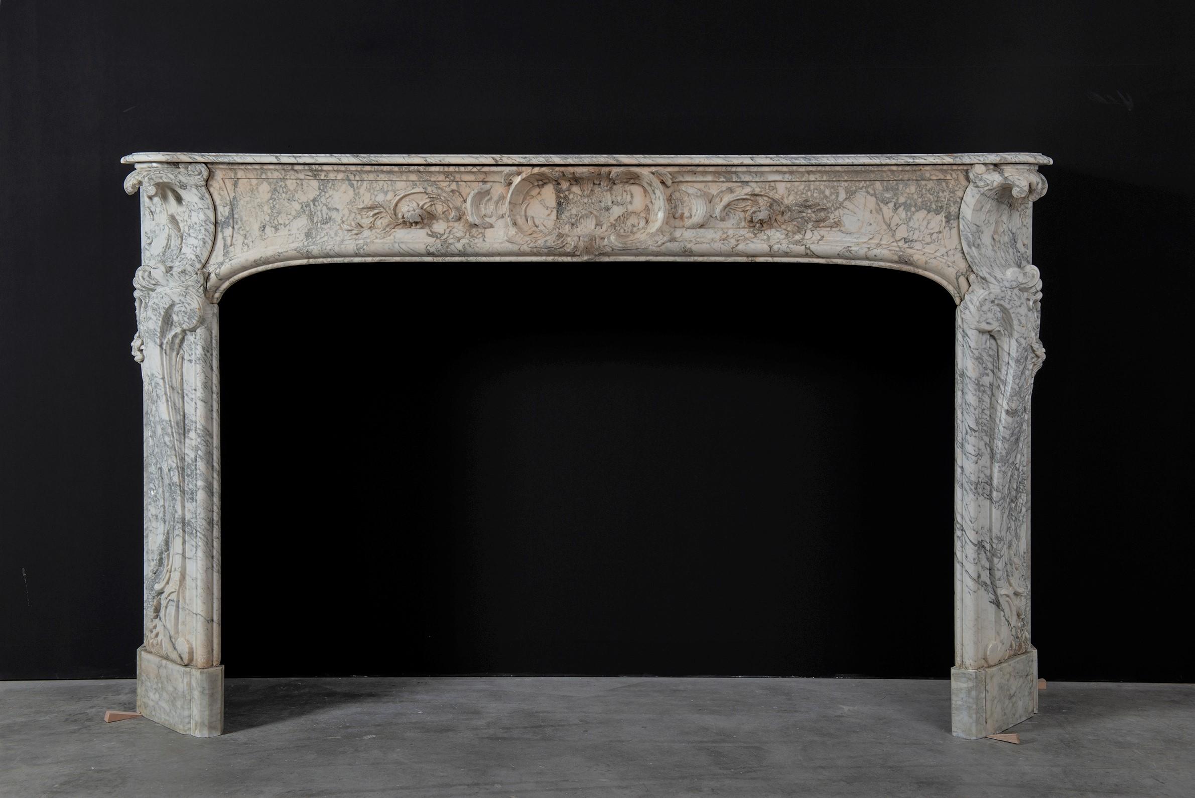 Alluring 18th century Dutch Louis XV fireplace mantel.

Very pleased to offer this alluring Dutch Louis XV fireplace mantel in striking Arabescato marble. 
This soft white toned Italian marble is world famous for its wild greyish veins and its