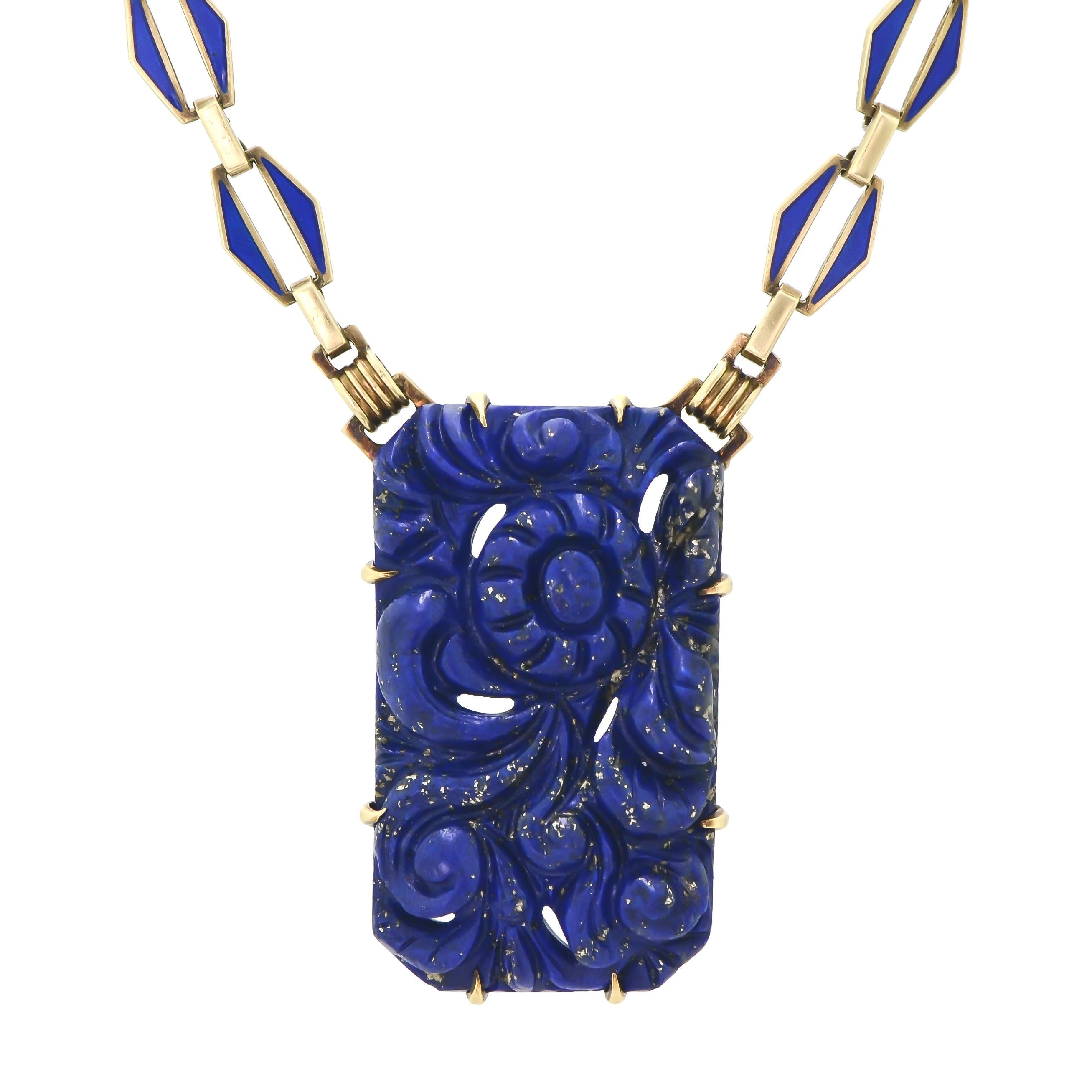 Sensational Art Deco lapis and enamel necklace containing a total of five (5) vivid royal blue Lapis Lazuli plaques. Each plaque is craved with graceful foliate design joined by classic Art Deco blue enamel links of fluted 14K yellow gold in this