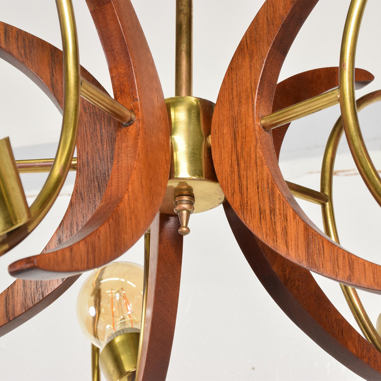 Mexican 1960s Alluring Five Ring Sculptural Chandelier Brass and Mahogany Mexico City For Sale