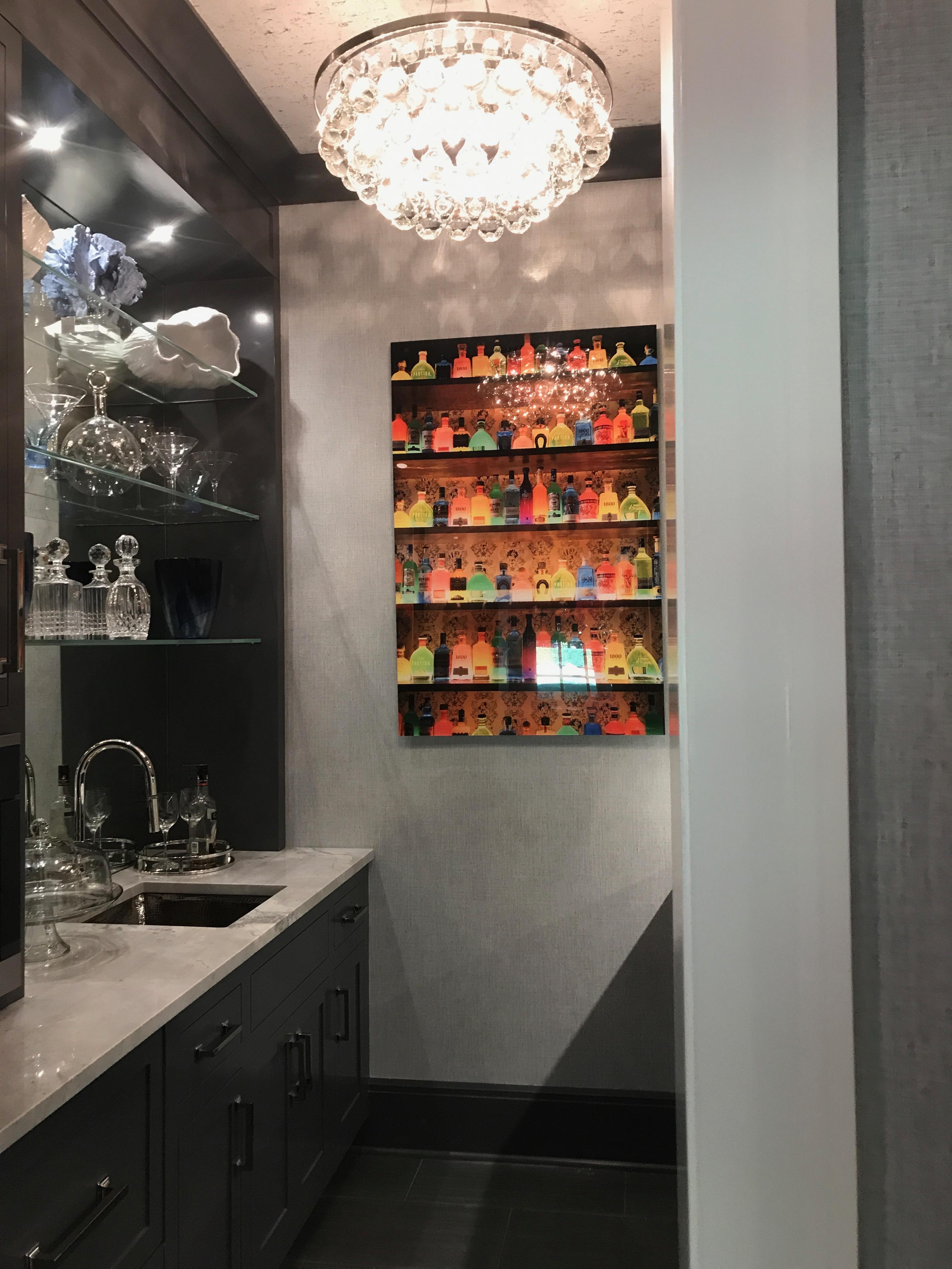 Photographer Allyson Monson invites you to see everything around her through her own eye, just a little bit differently than others, including a display of tequila bottles. The original image in a much loved series exhibits Allyson's keen eye for