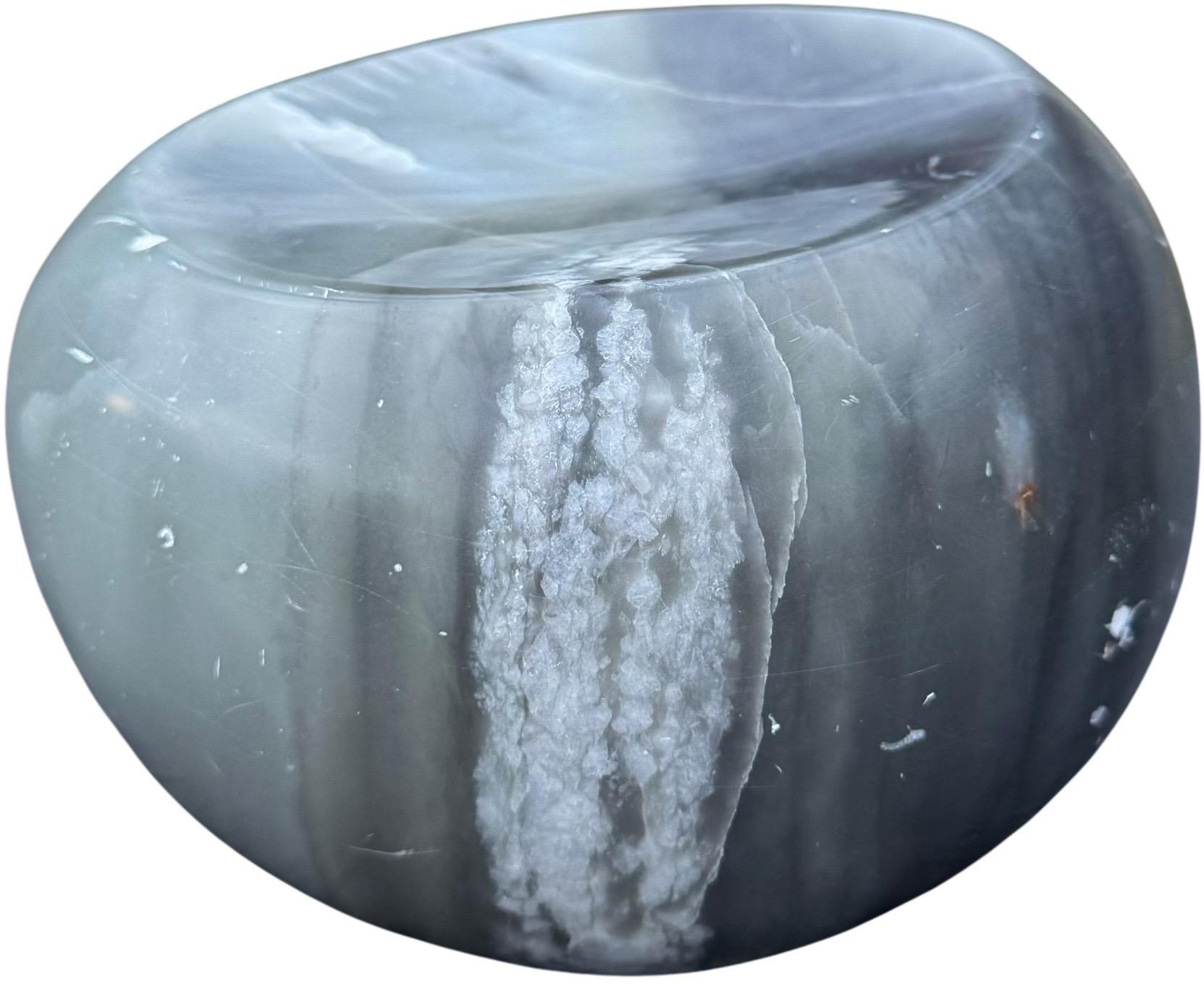 Carved during Allen’s early years, this intimate grey marble sculpture has the quiet gravity of something discovered rather than made. Allen has always favored materials with their own inner weather, and here the marble shows soft drifting veils of