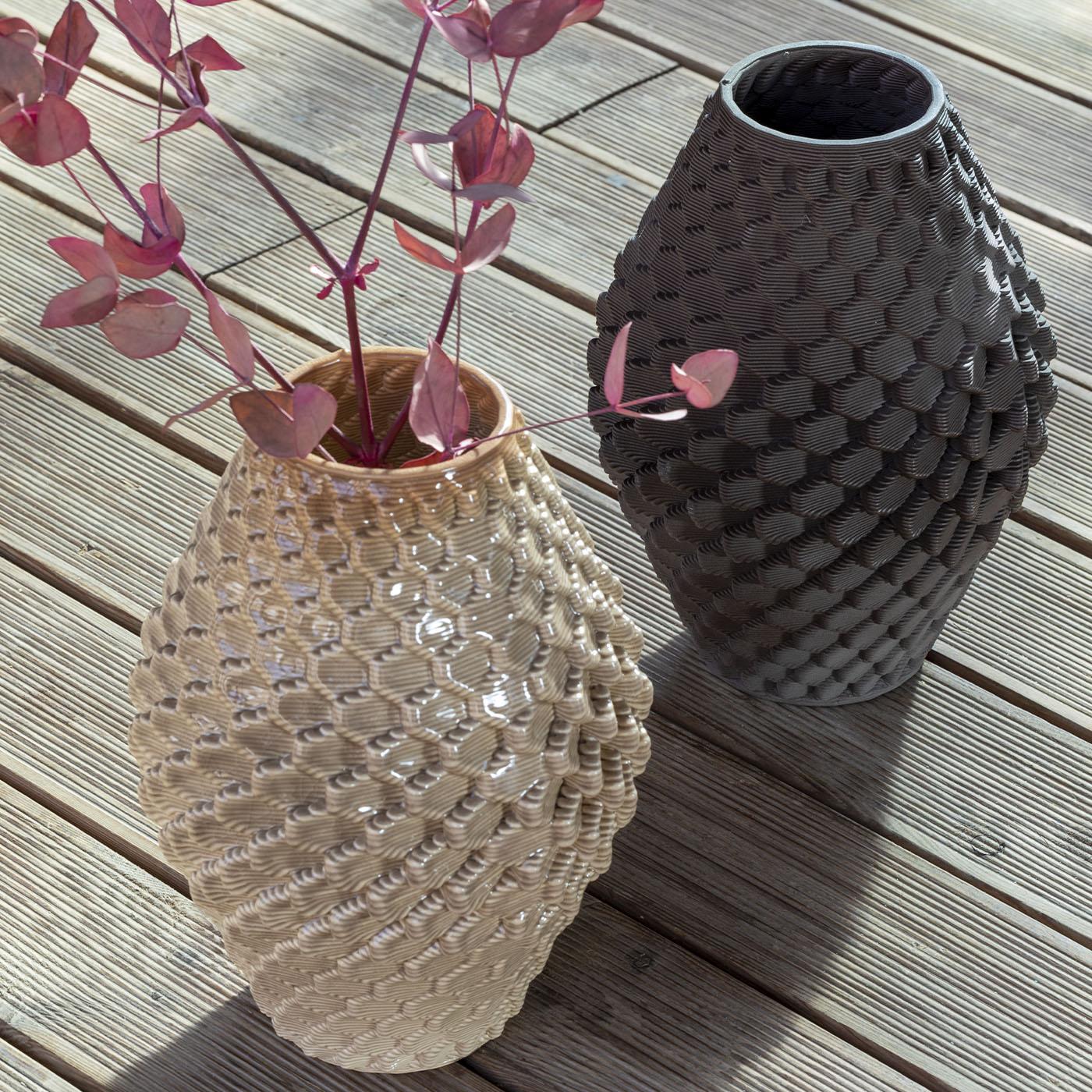 Alma, a 3D-printed vase, draws from the Caltagirone pine cone's shape, symbolizing vitality and eternity. Combining digital artistry, craftsmanship, and nature, it embodies Sicilian allure. Reflecting the fertility of the mind and novel ideas, Alma