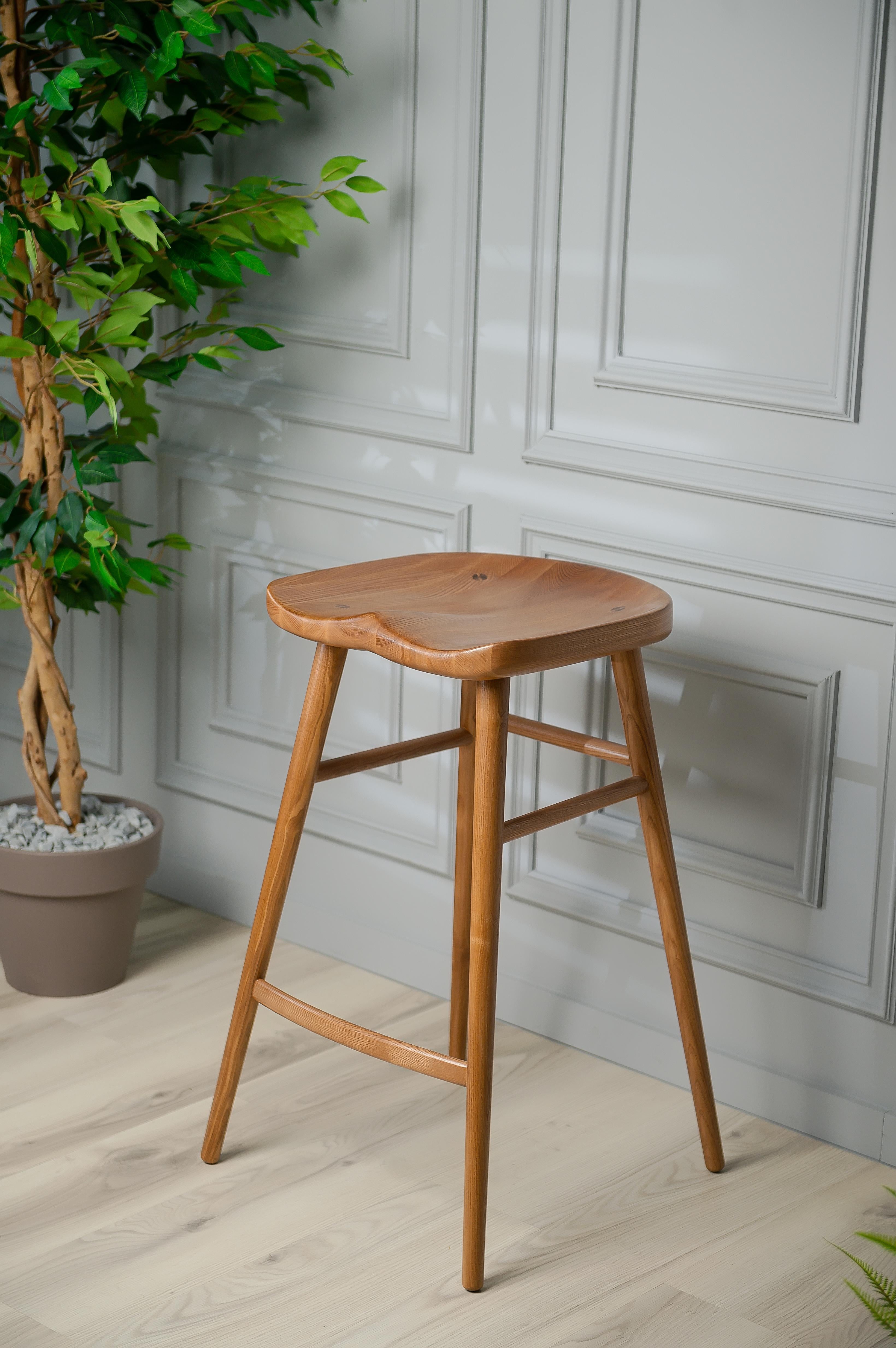 The Alma Bar Stool is perfect for any bar or leisure area of your mom. This modern stained bar stool will help to entertain guests while adding a style functionality that you can’t miss. Made with ash wood, the Alma Bar Stool will last generation