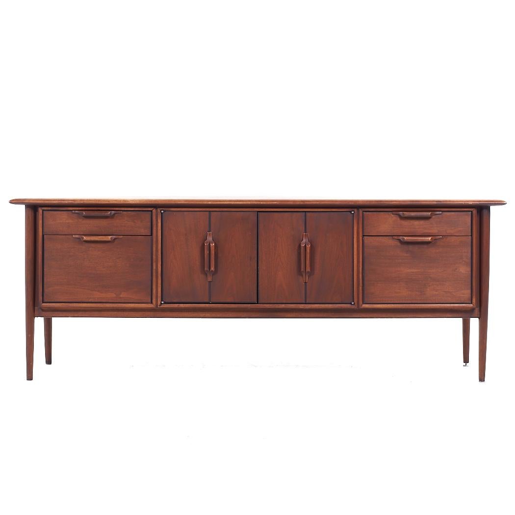 Alma Castilian Mid Century Walnut Credenza

This credenza measures: 77.5 wide x 21 deep x 28.75 inches high

All pieces of furniture can be had in what we call restored vintage condition. That means the piece is restored upon purchase so it’s free