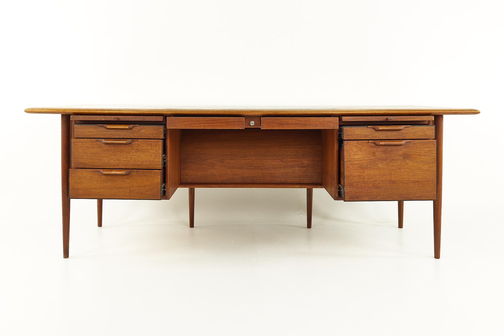 Alma Castilian Line Mid Century Walnut Executive Desk

This desk measures: 83.5 wide x 40.25 deep x 28.75 inches high, with a chair clearance of 25.25 inches

All pieces of furniture can be had in what we call restored vintage condition. That means
