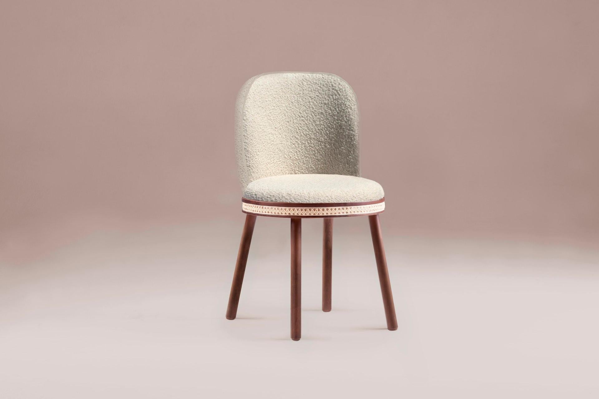 Chair, Alma by Dooq
Measures: W 51 cm 20”
D 53 cm 21”
H 86 cm 34”
Seat height 49 cm 19”

Materials: Upholstery fabric or leather; structure solid wood feet lacquered MDF or solid wood rattan natural rattan. COM with natural walnut or natural