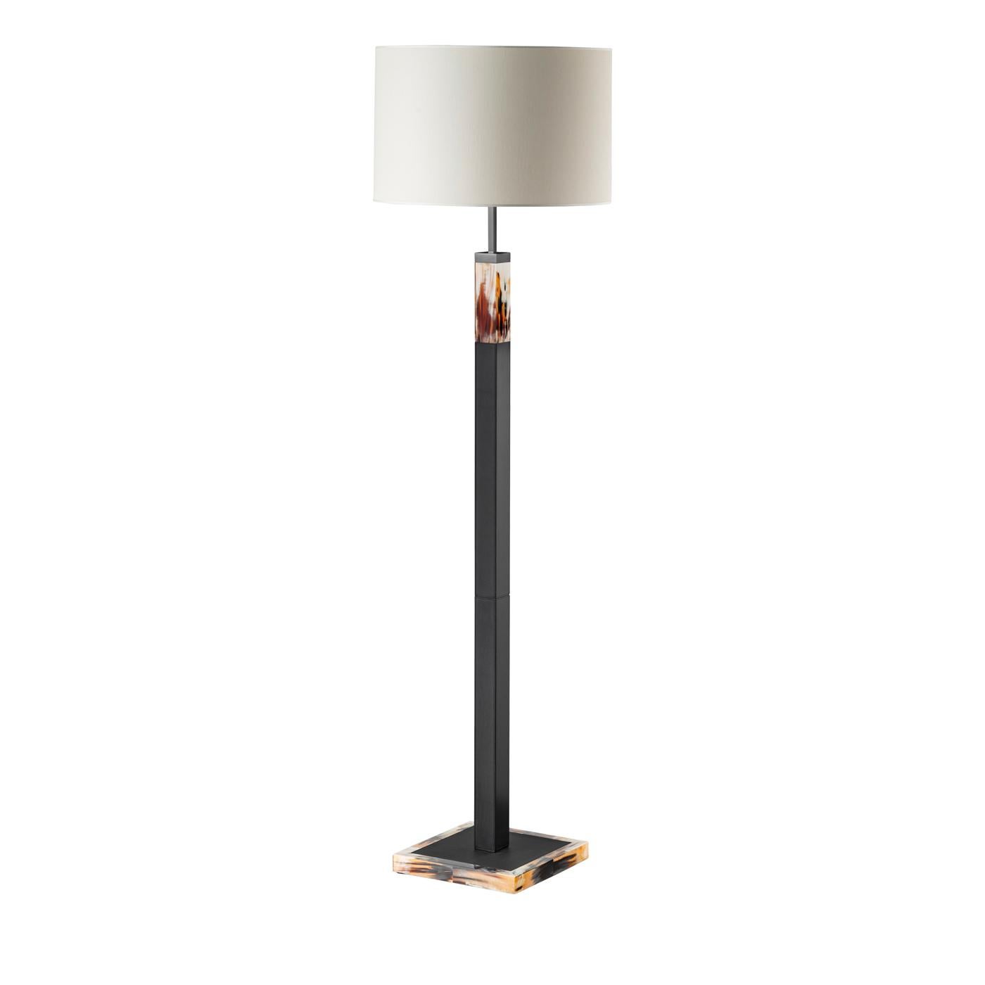 Elegant and timeless, the design of this floor lamp plays with pure geometric elements to create a splendid effect in any modern interior. Luxurious and stately, it features a slender, gunmetal brass stem rising from a sturdy, square base in the